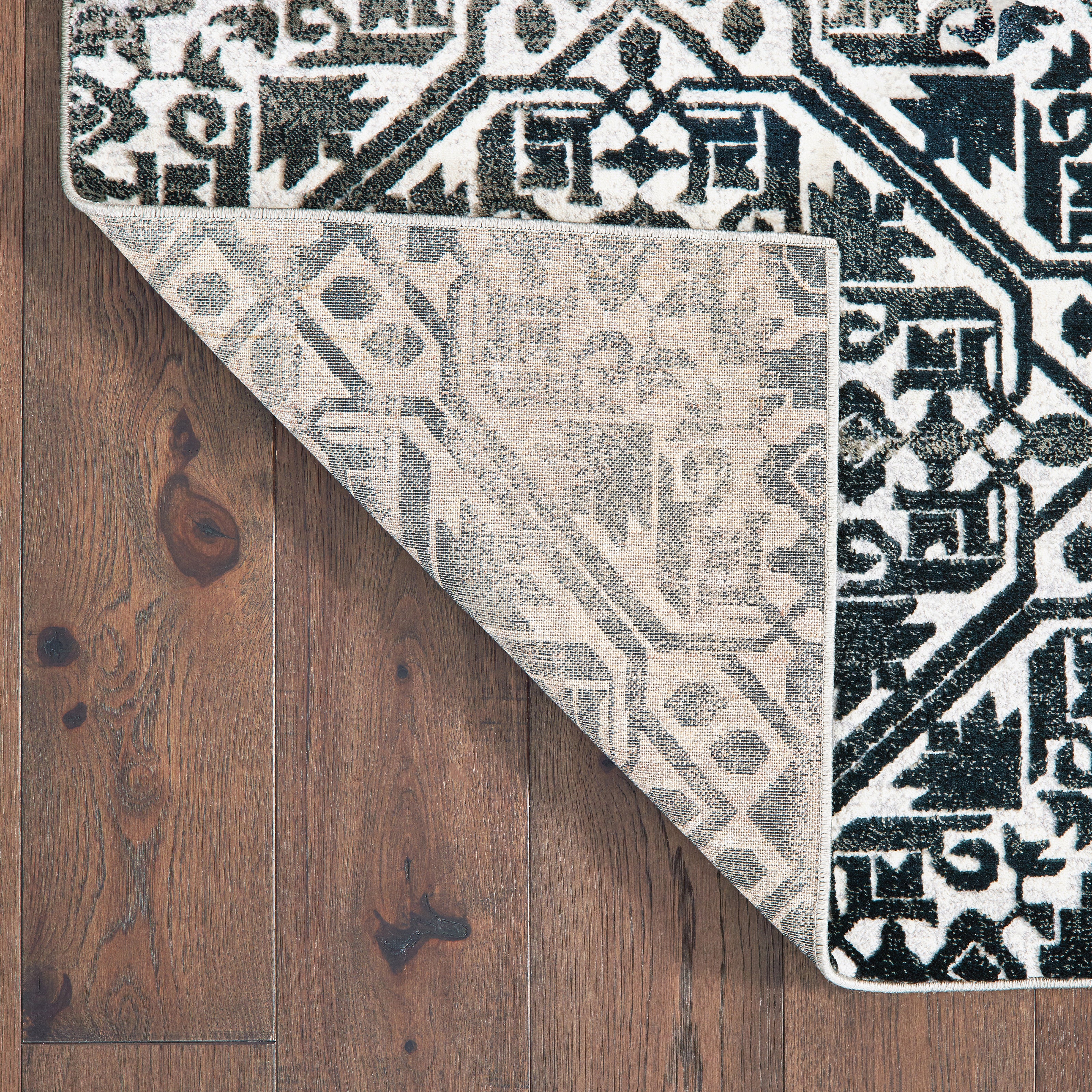 Oriental Weavers Bowen 5506E soft transitional rug featuring textured design in navy/ ivory tones