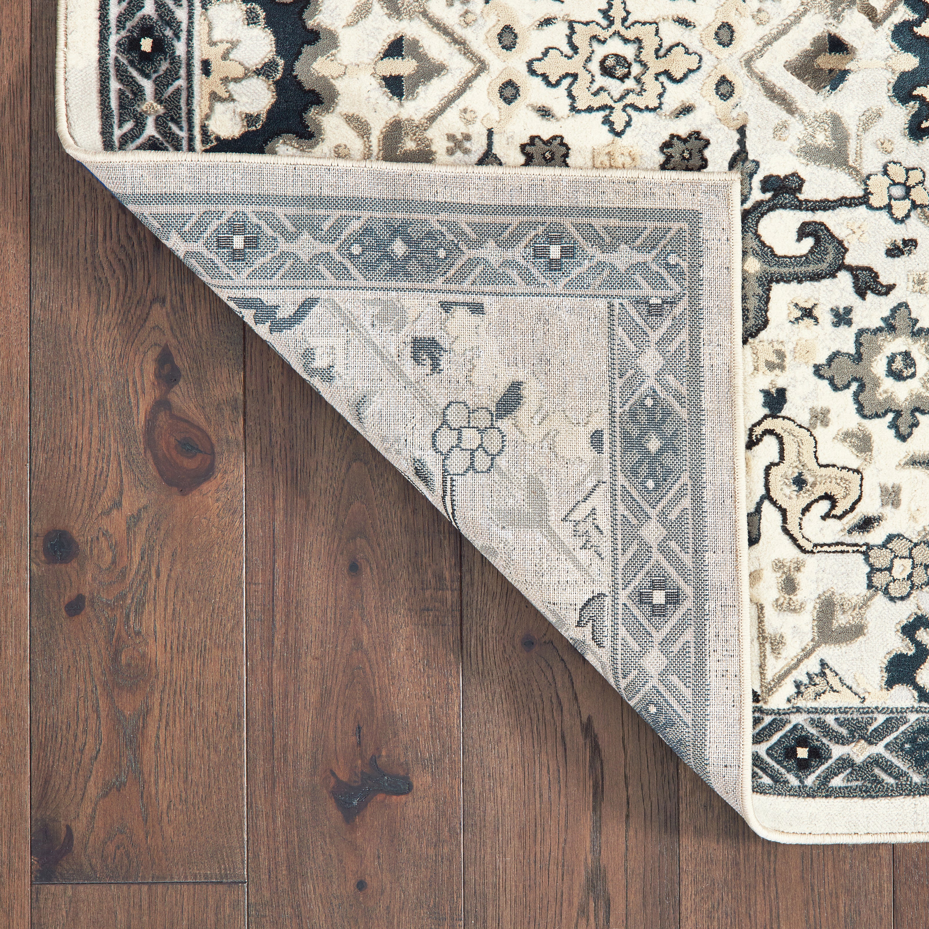 Oriental Weavers Bowen 073J2 soft transitional rug featuring textured design in ivory/ navy tones