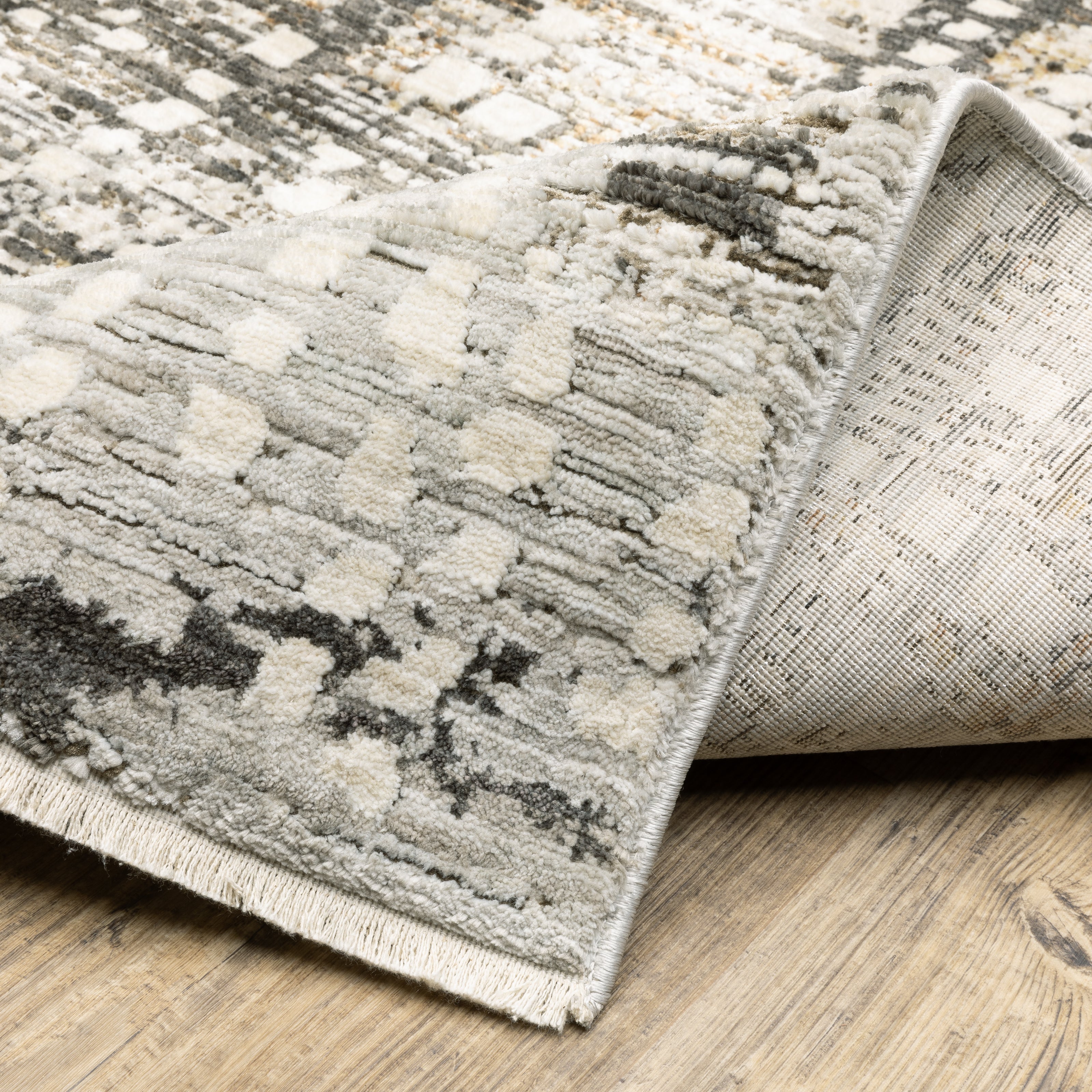 Oriental Weavers Branigan BRG01 soft modern rug featuring abstract pattern in ivory / brown tones