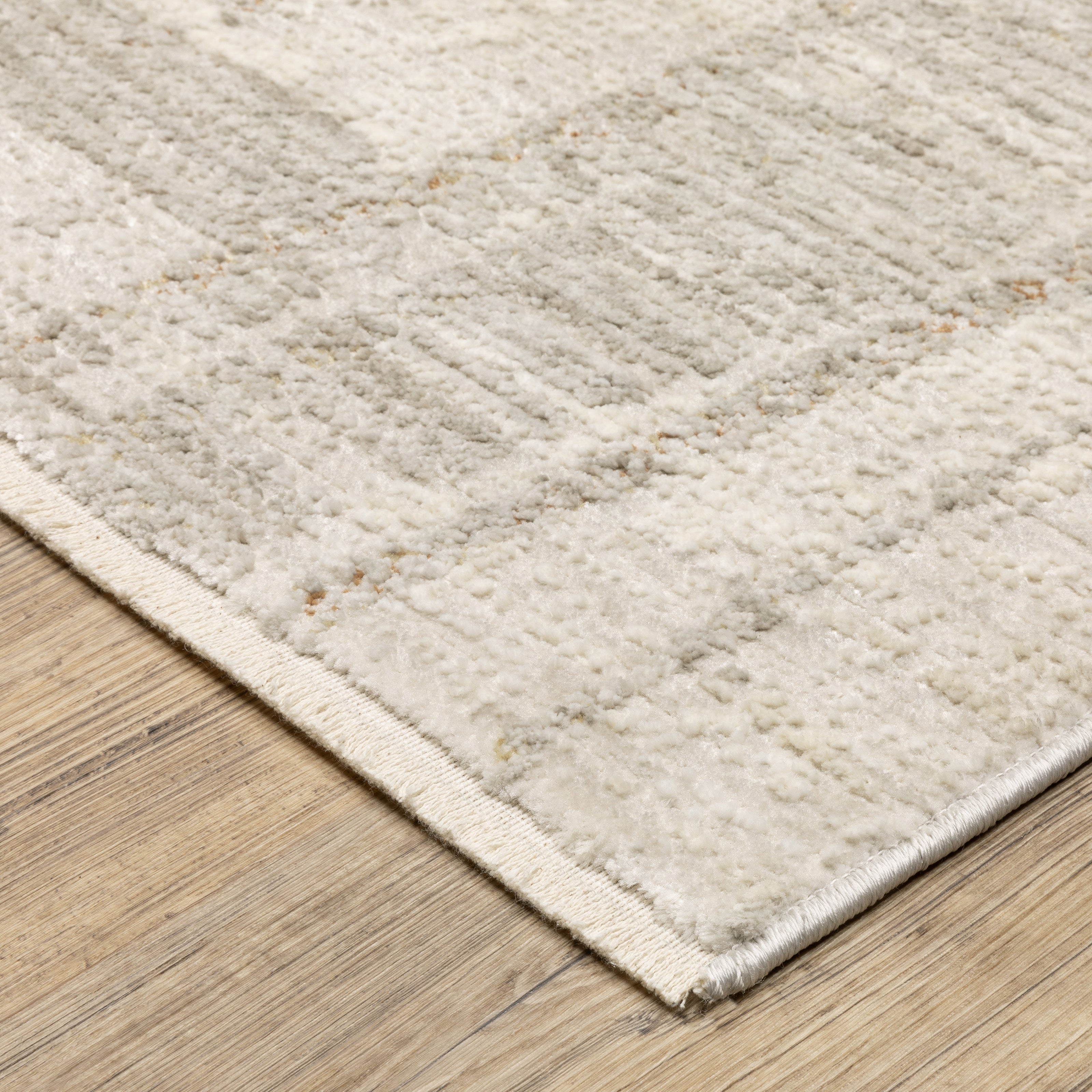 Oriental Weavers Branigan BRG04 soft traditional rug featuring abstract pattern in ivory / gold tones