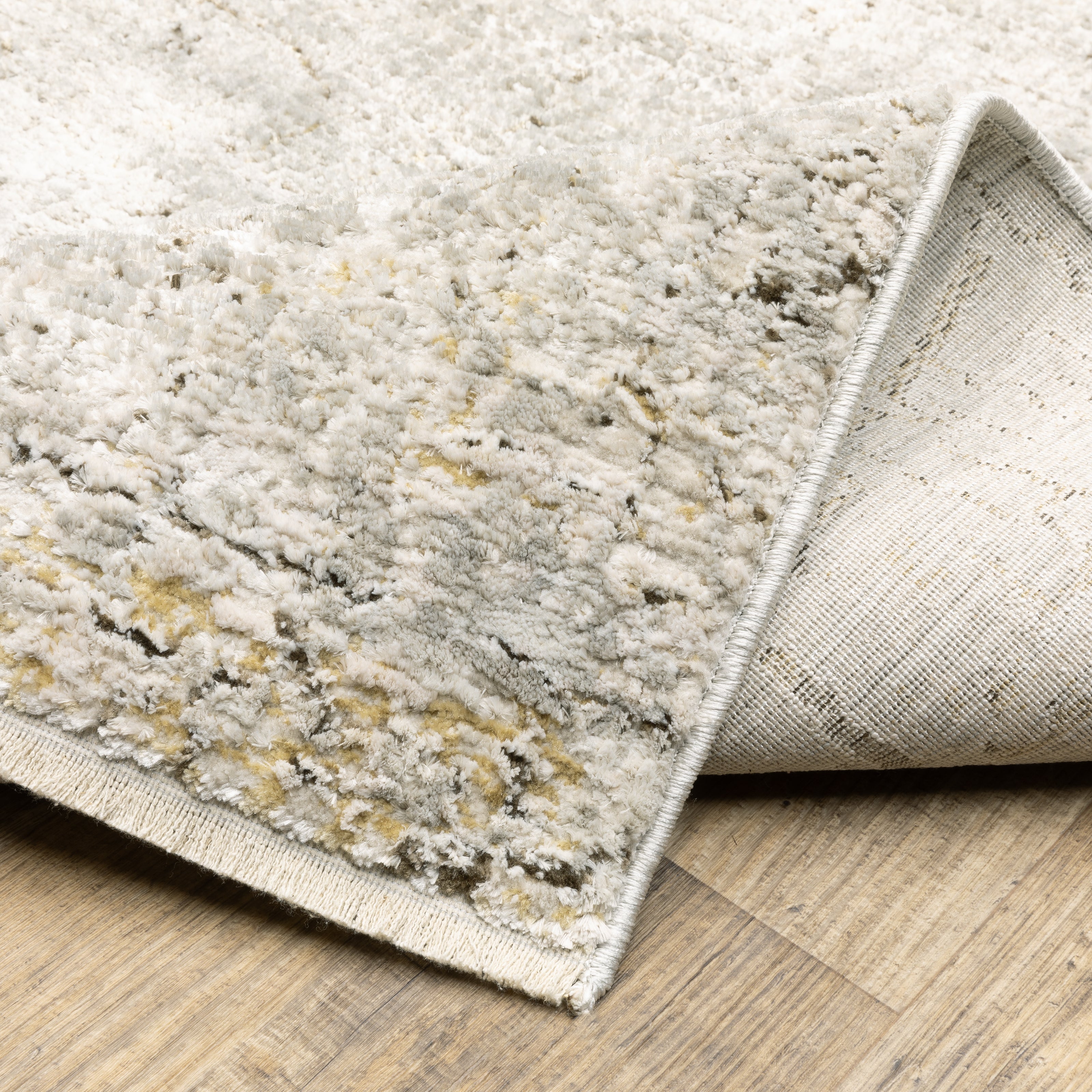 Oriental Weavers Branigan BRG05 soft modern rug featuring abstract pattern in grey/ gold tones