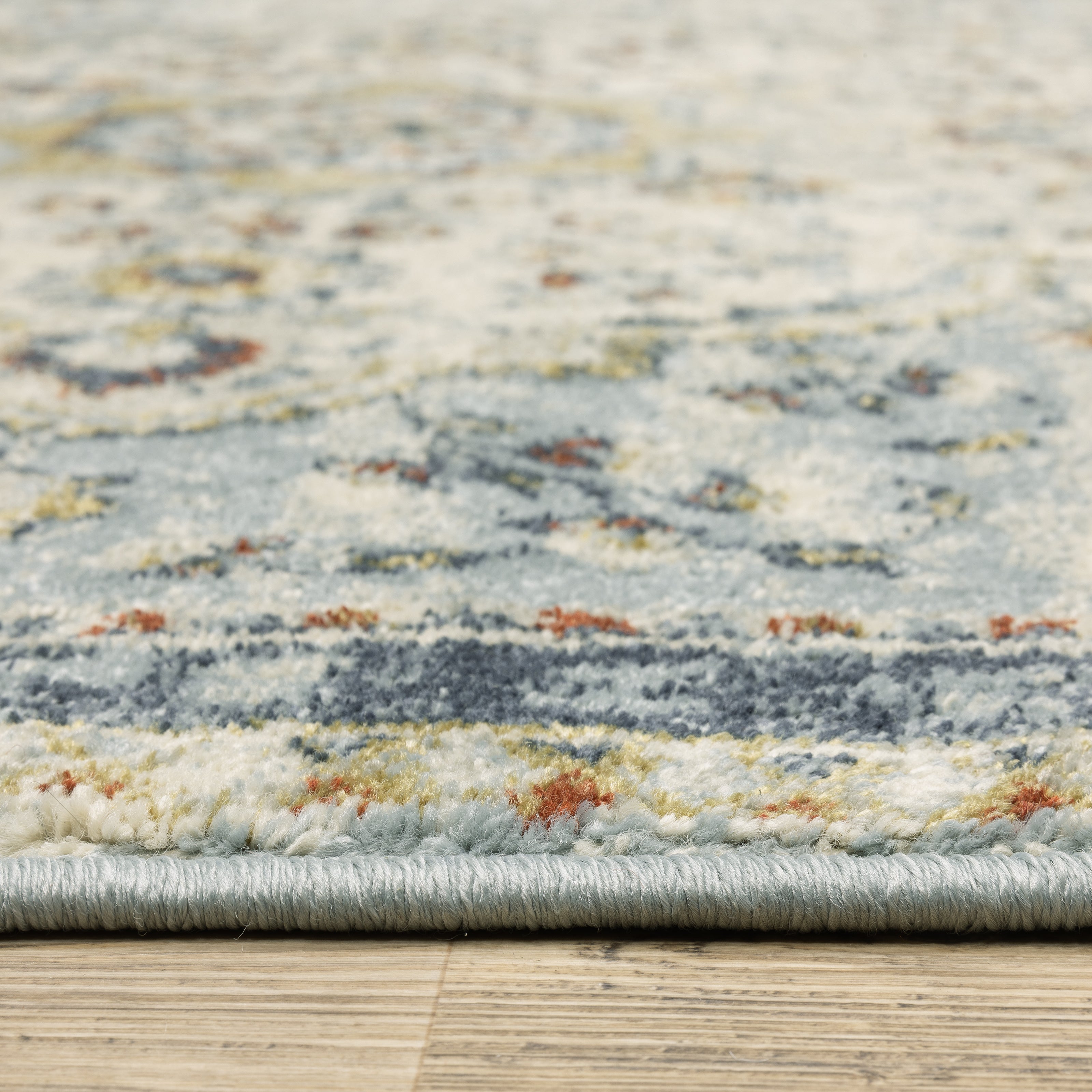 Oriental Weavers Branson BR01A soft transitional rug featuring textured design in blue/ multi tones