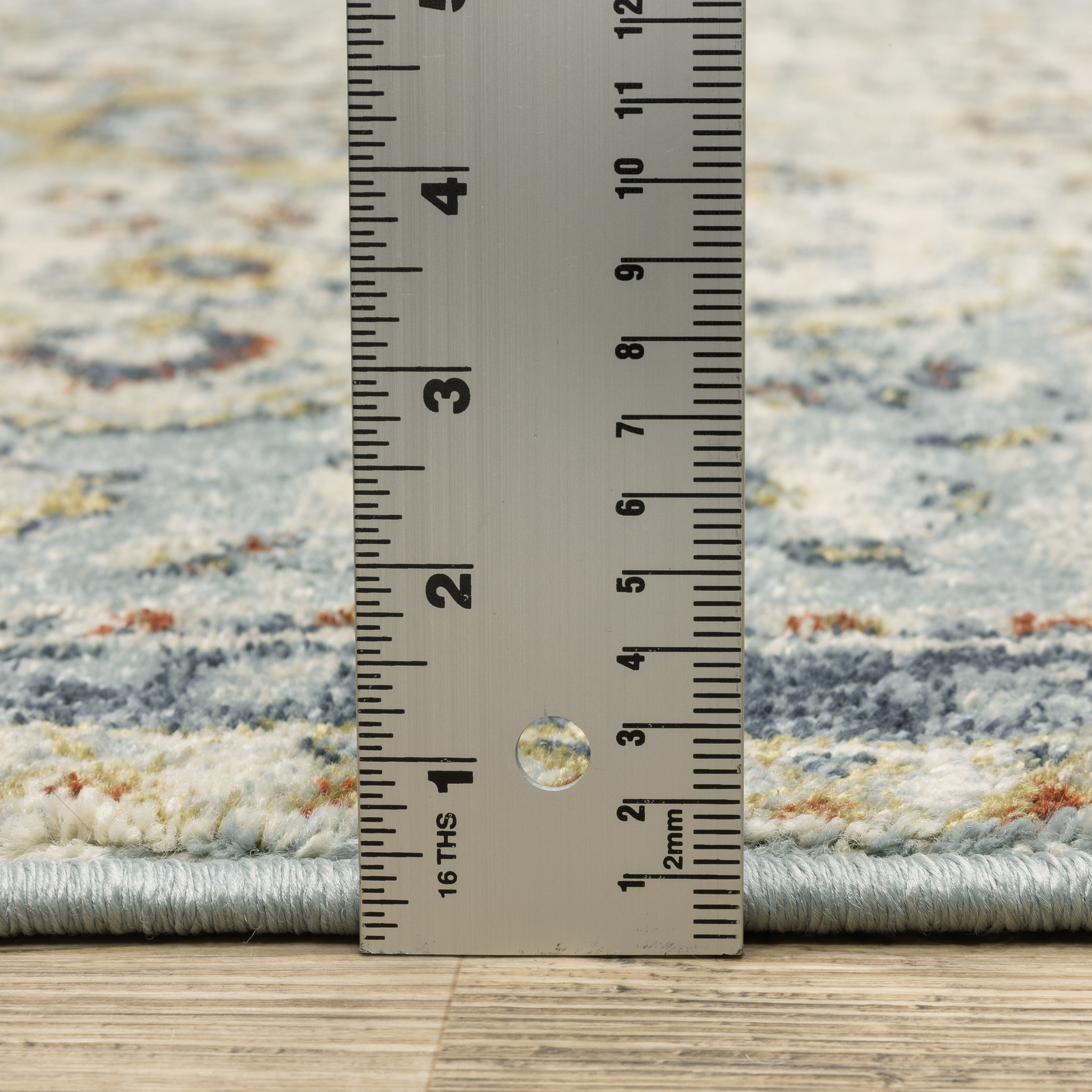 Oriental Weavers Branson BR01A soft transitional rug featuring textured design in blue/ multi tones