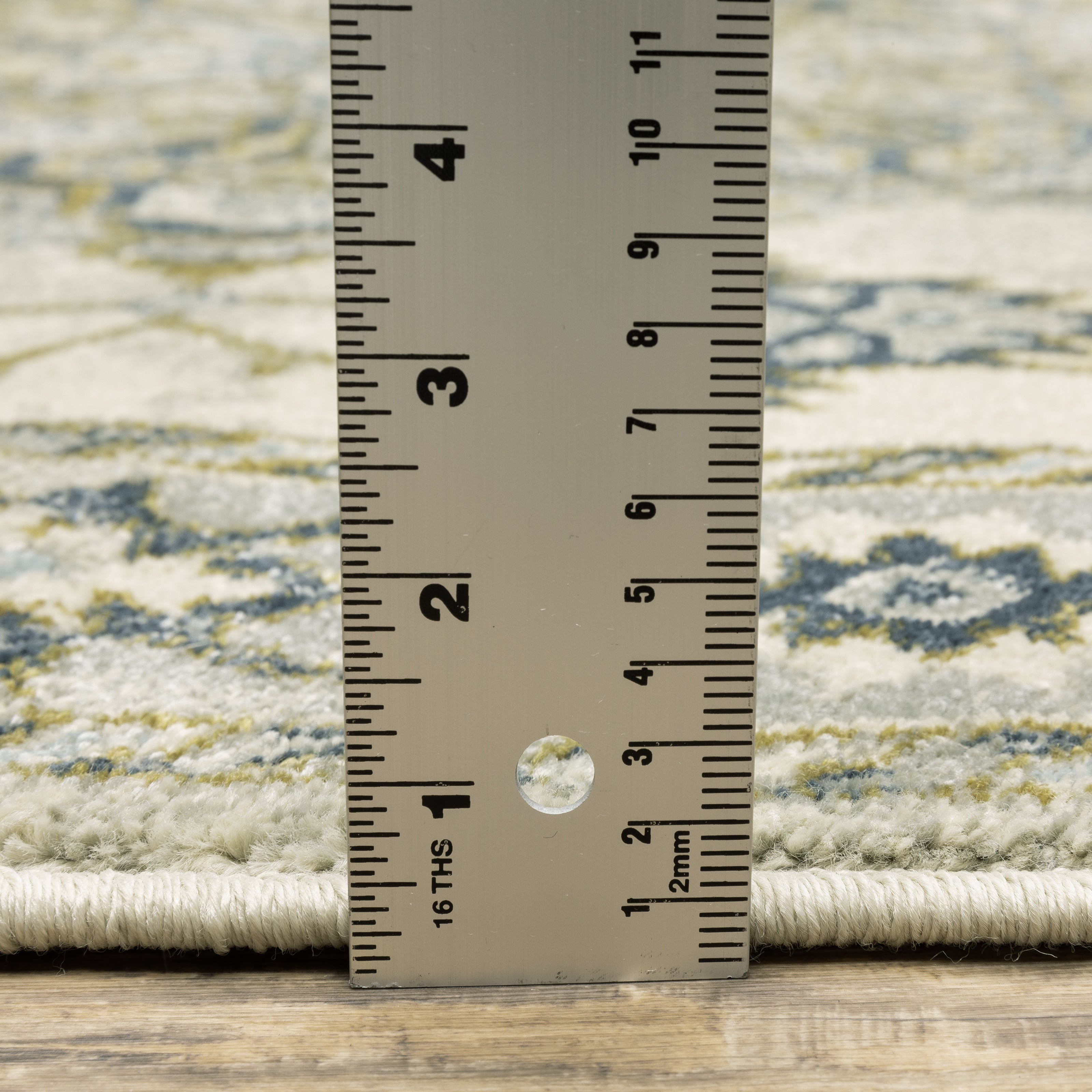 Oriental Weavers Branson BR04B soft transitional rug featuring textured design in ivory/ blue tones