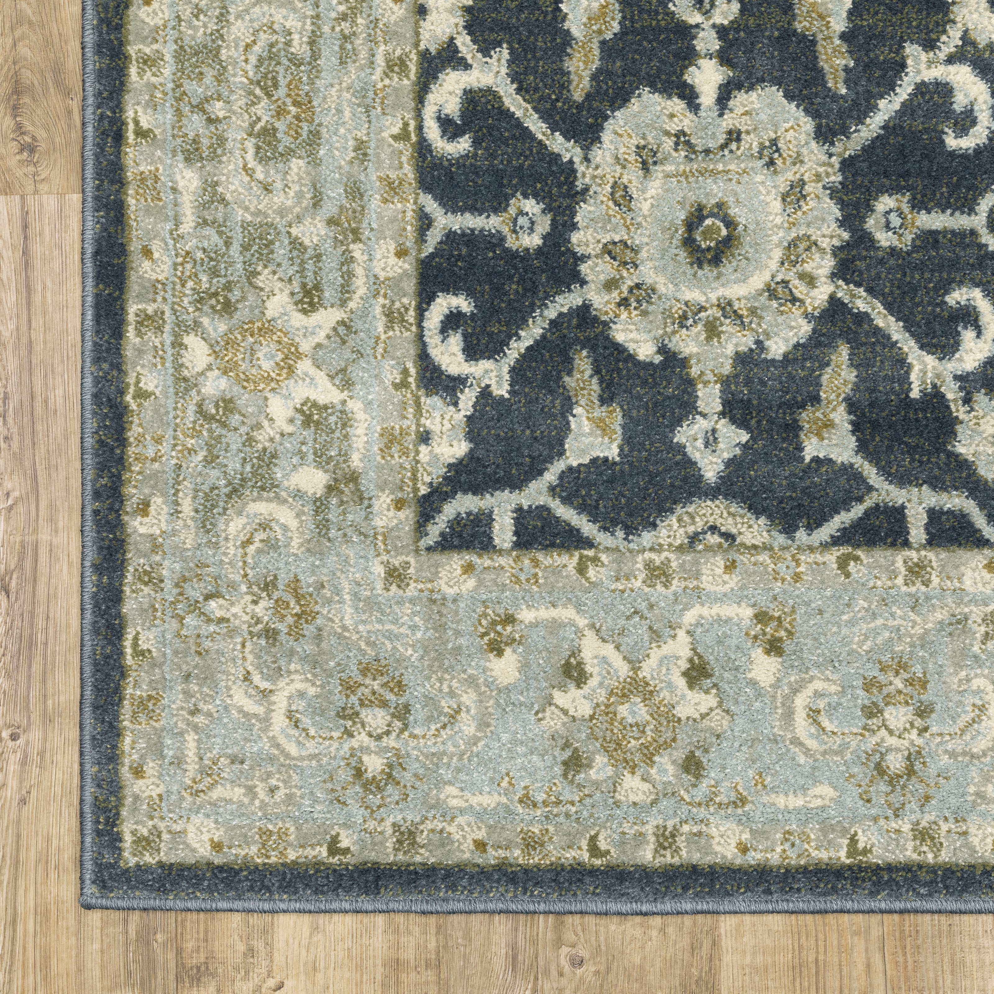 Oriental Weavers Branson BR05A soft transitional rug featuring textured design in teal blue/ ivory tones