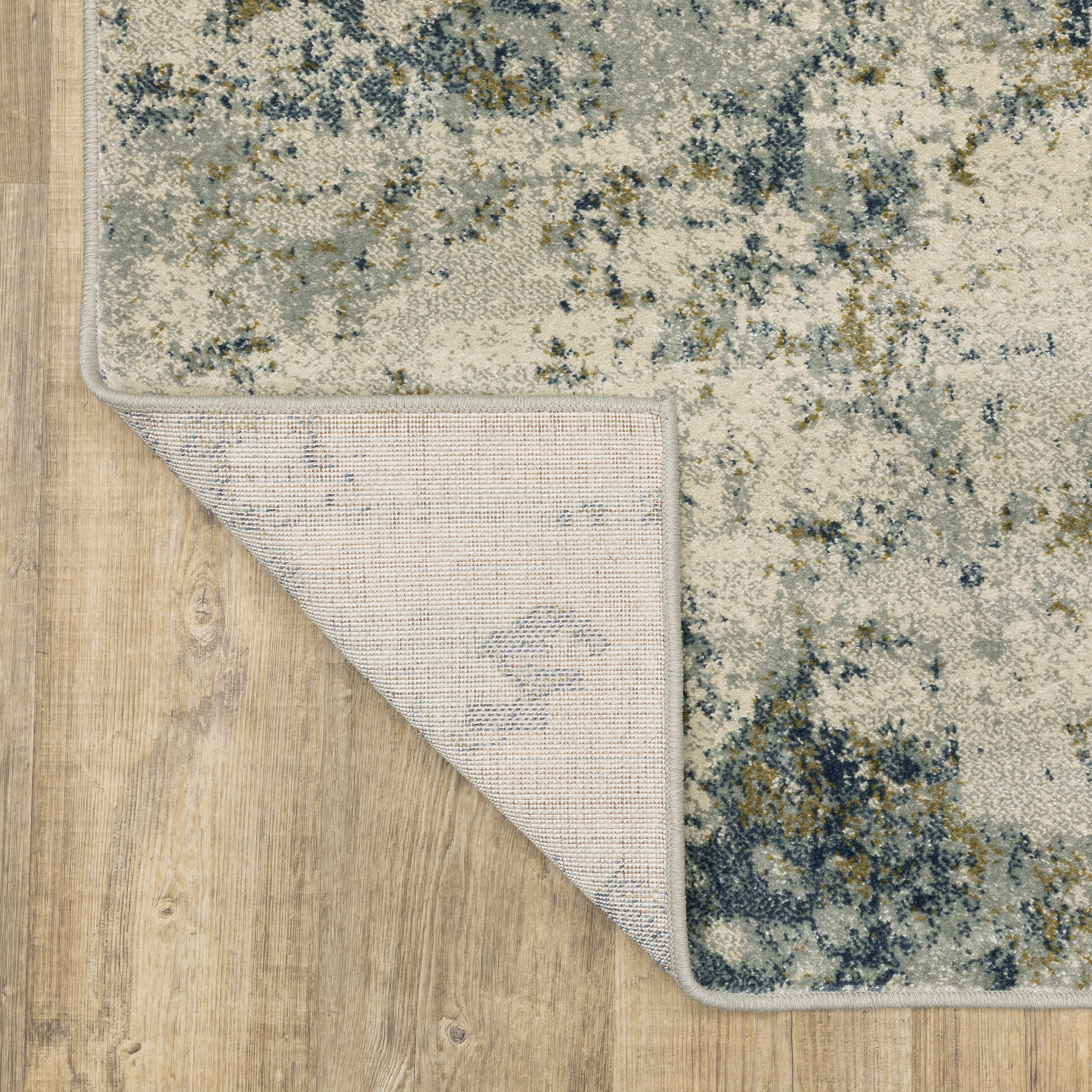 Oriental Weavers Branson BR12A soft transitional rug featuring textured design in beige/ teal tones