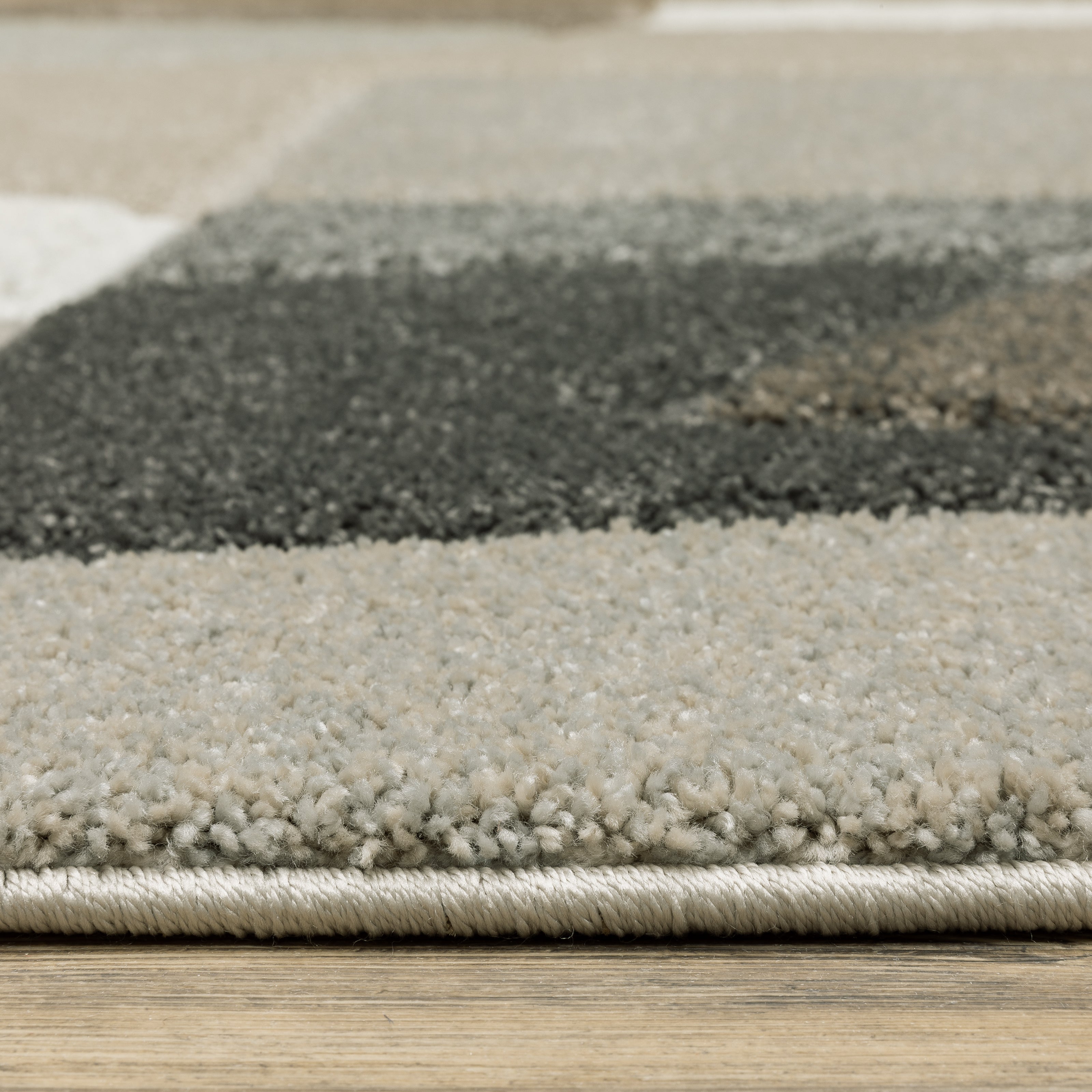 Oriental Weavers Cambria 084J2 plush modern rug featuring abstract pattern in beige/ multi tones