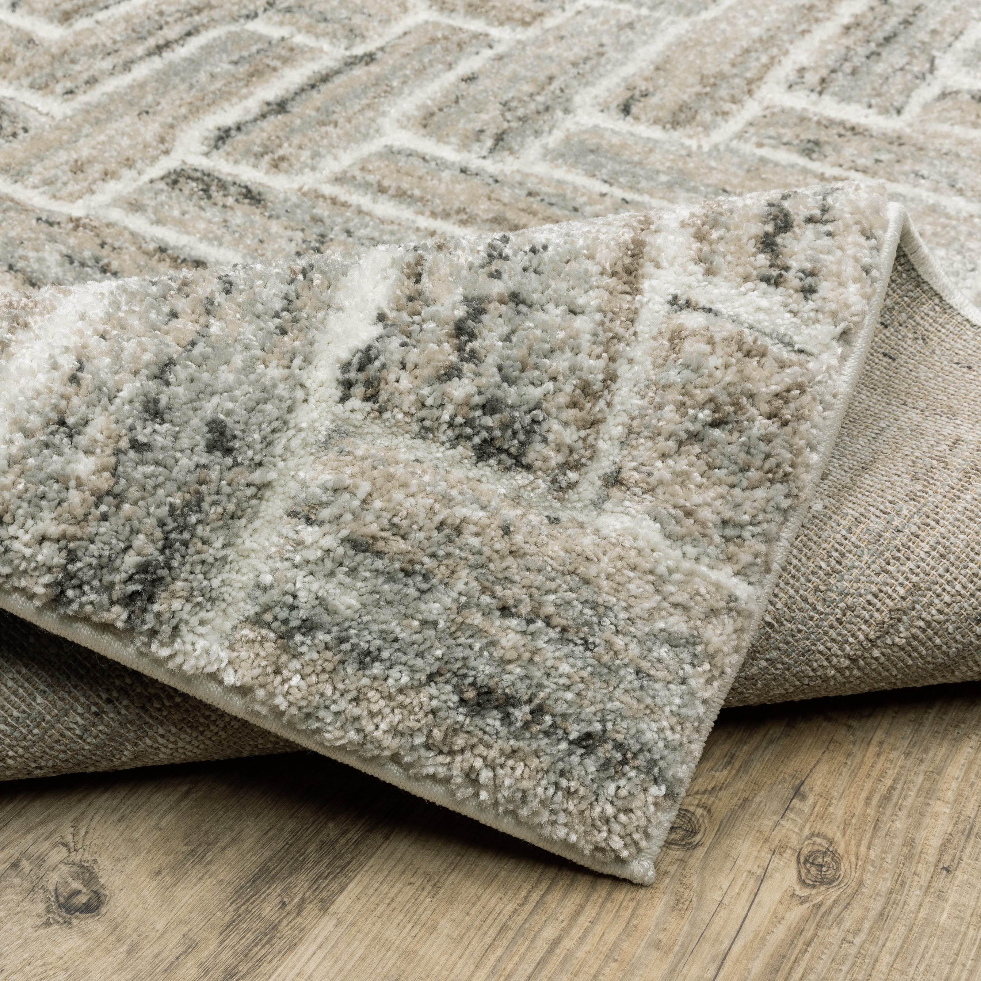 Oriental Weavers Cambria 093L2 plush modern rug featuring abstract pattern in ivory/ beige tones