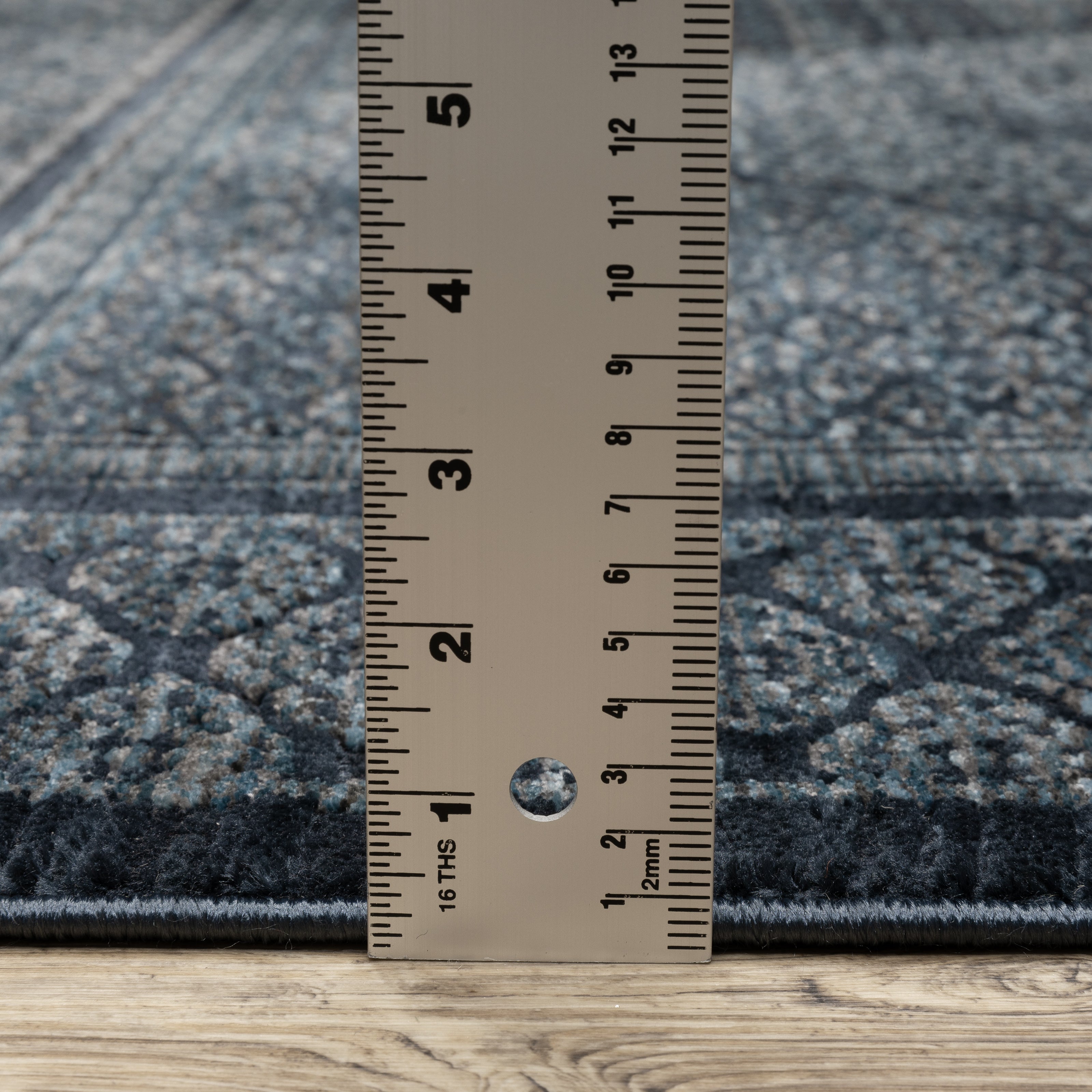Oriental Weavers Capella CAP01 soft transitional rug featuring textured design in blue/ teal tones