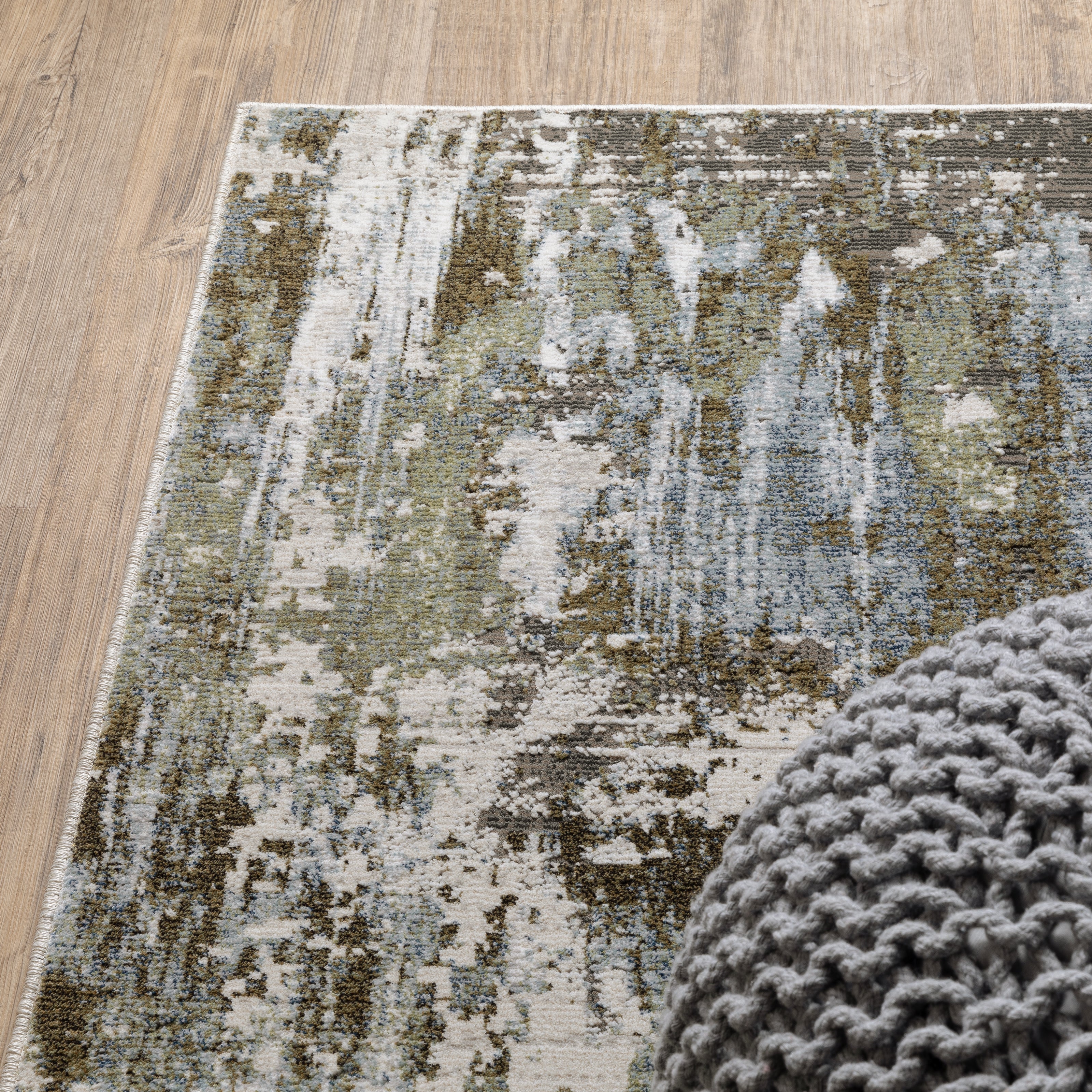 Oriental Weavers Caravan 2060F soft area rug featuring textured design in green/ blue tones