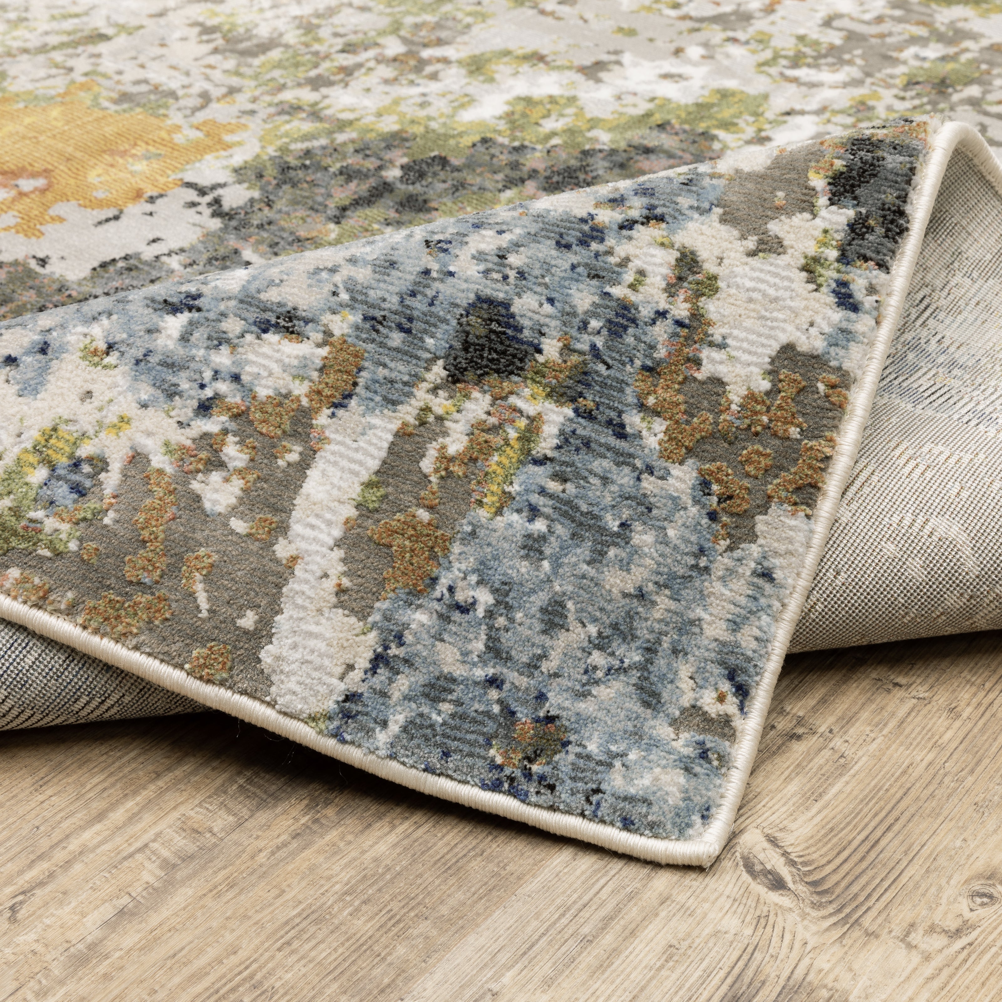 Oriental Weavers Caravan 502X8 soft area rug featuring textured design in grey/ multi tones
