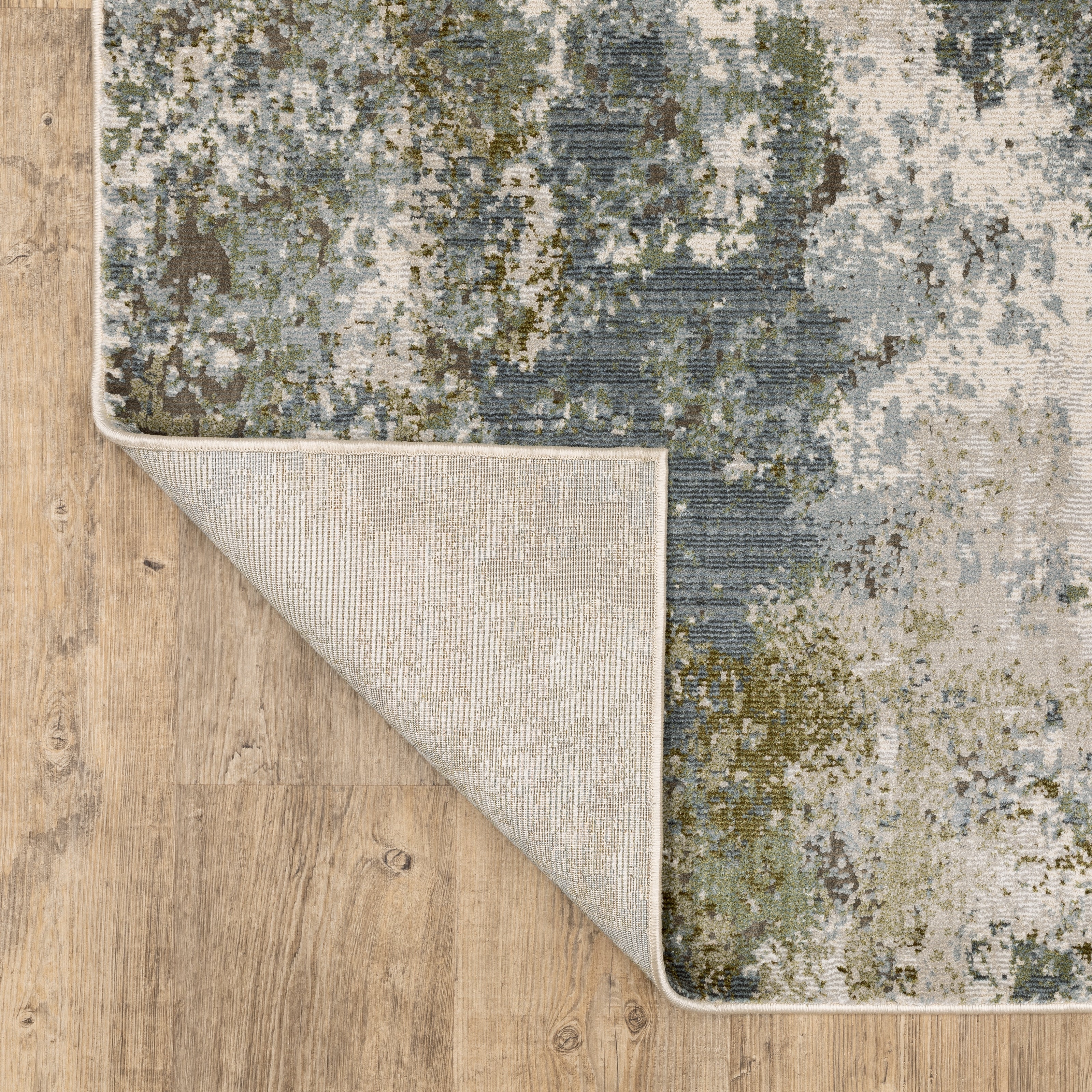 Oriental Weavers Caravan 5090E soft area rug featuring textured design in blue/ green tones