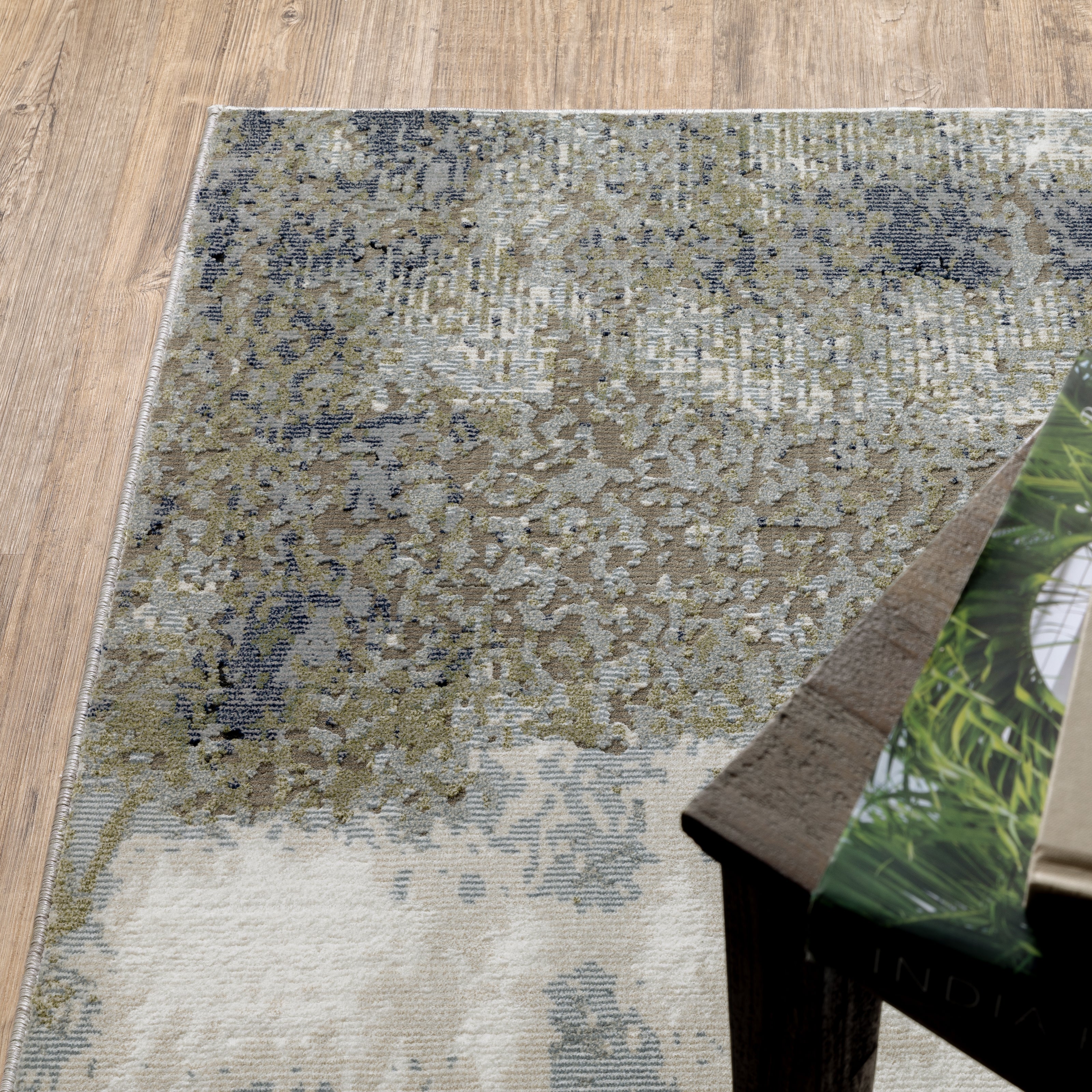 Oriental Weavers Caravan 5571H soft area rug featuring textured design in blue/ green tones