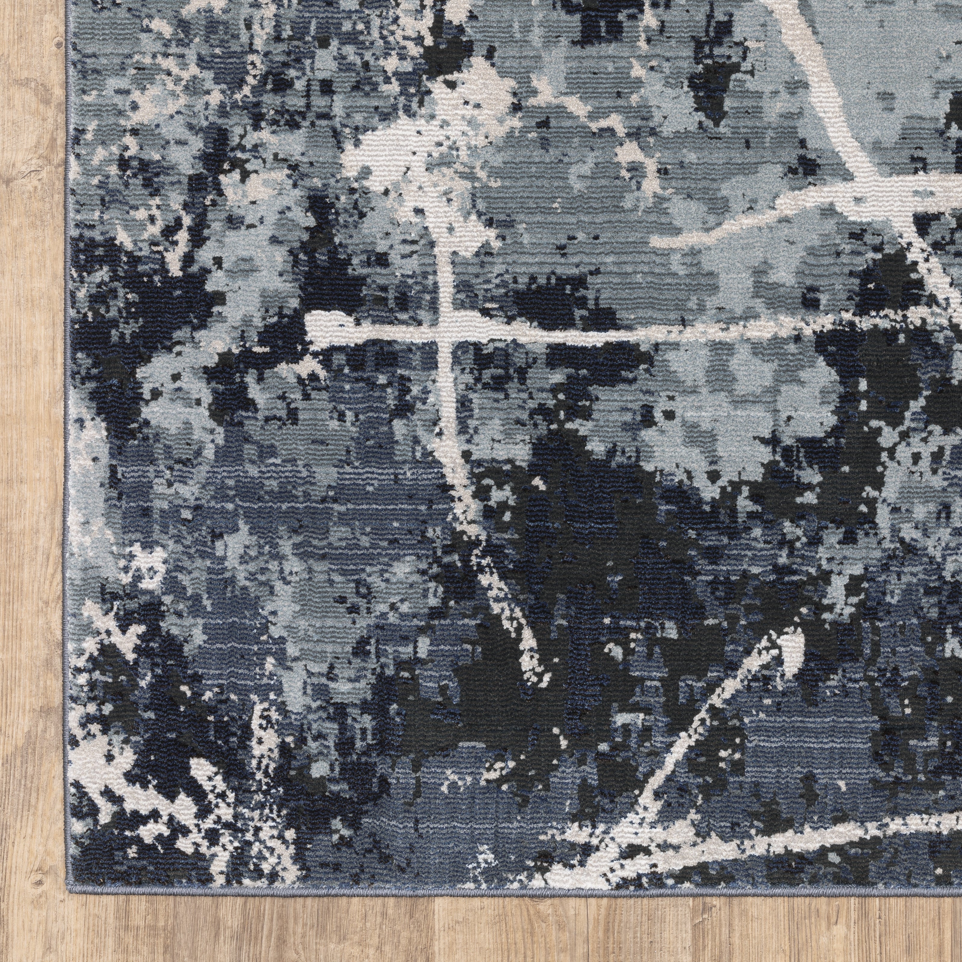Oriental Weavers Caravan 7150B soft area rug featuring textured design in blue/ grey tones