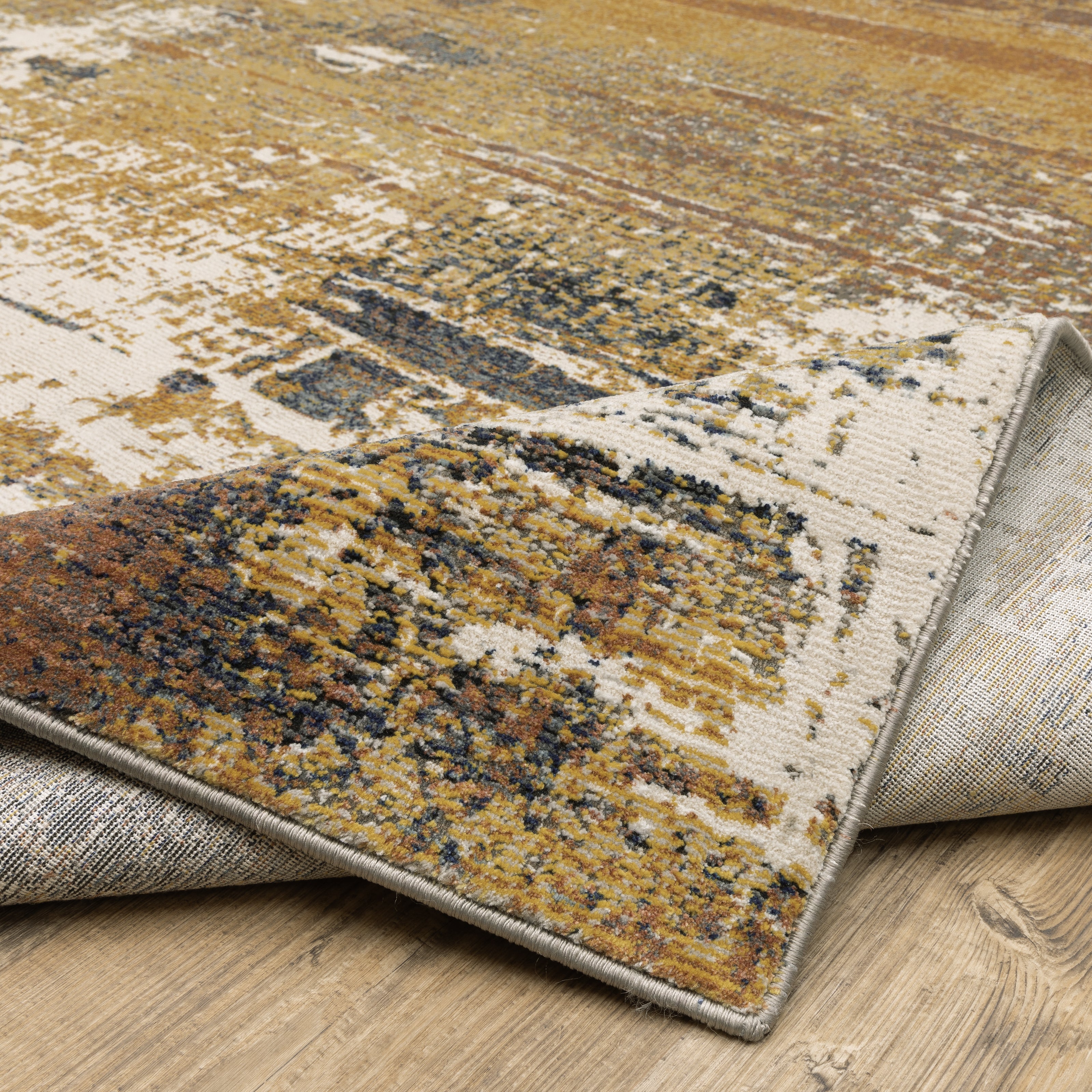 Oriental Weavers Caravan 8020X soft traditional rug featuring textured design in gold/ brown tones