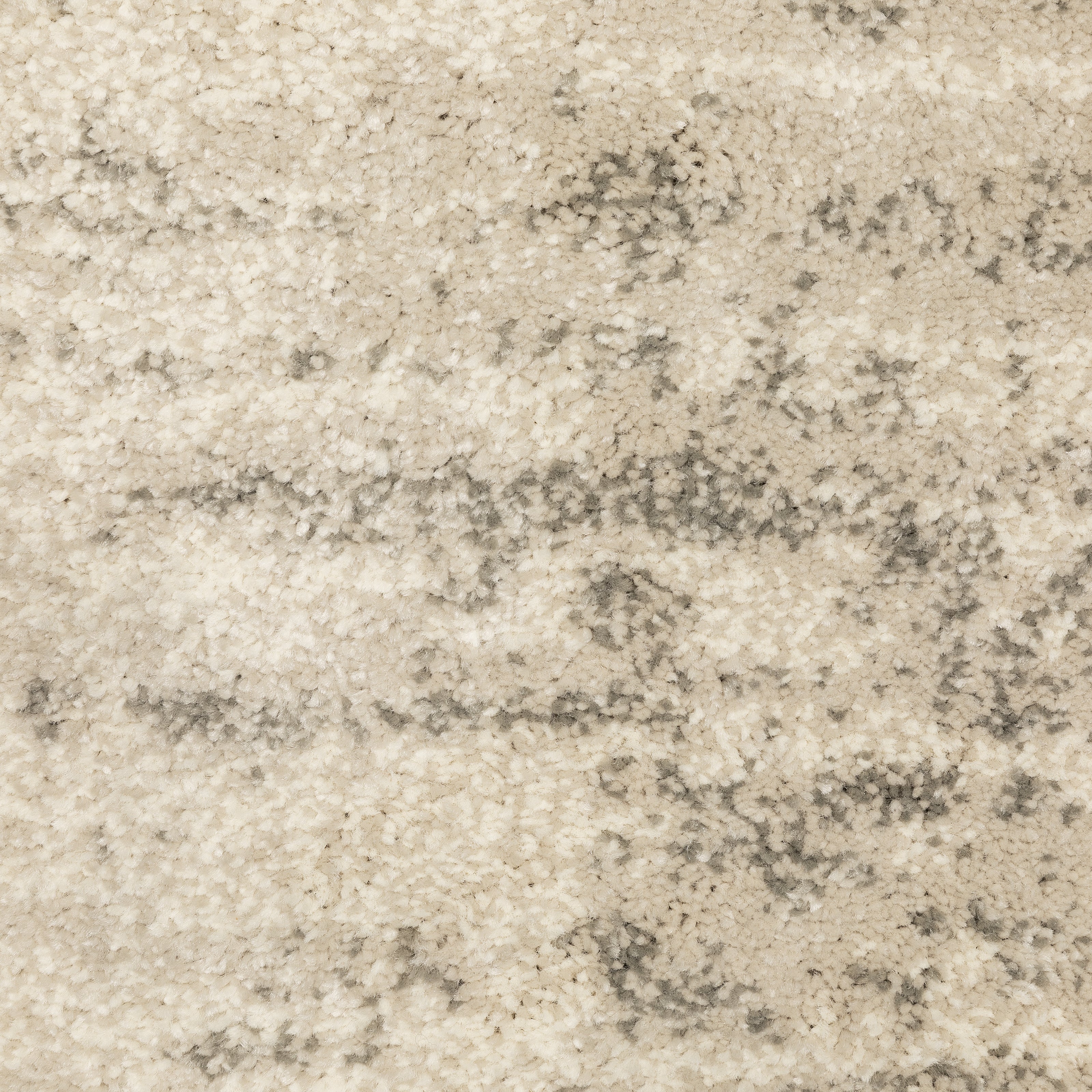 Oriental Weavers Carson 0735A plush modern rug featuring abstract pattern in beige/ grey tones