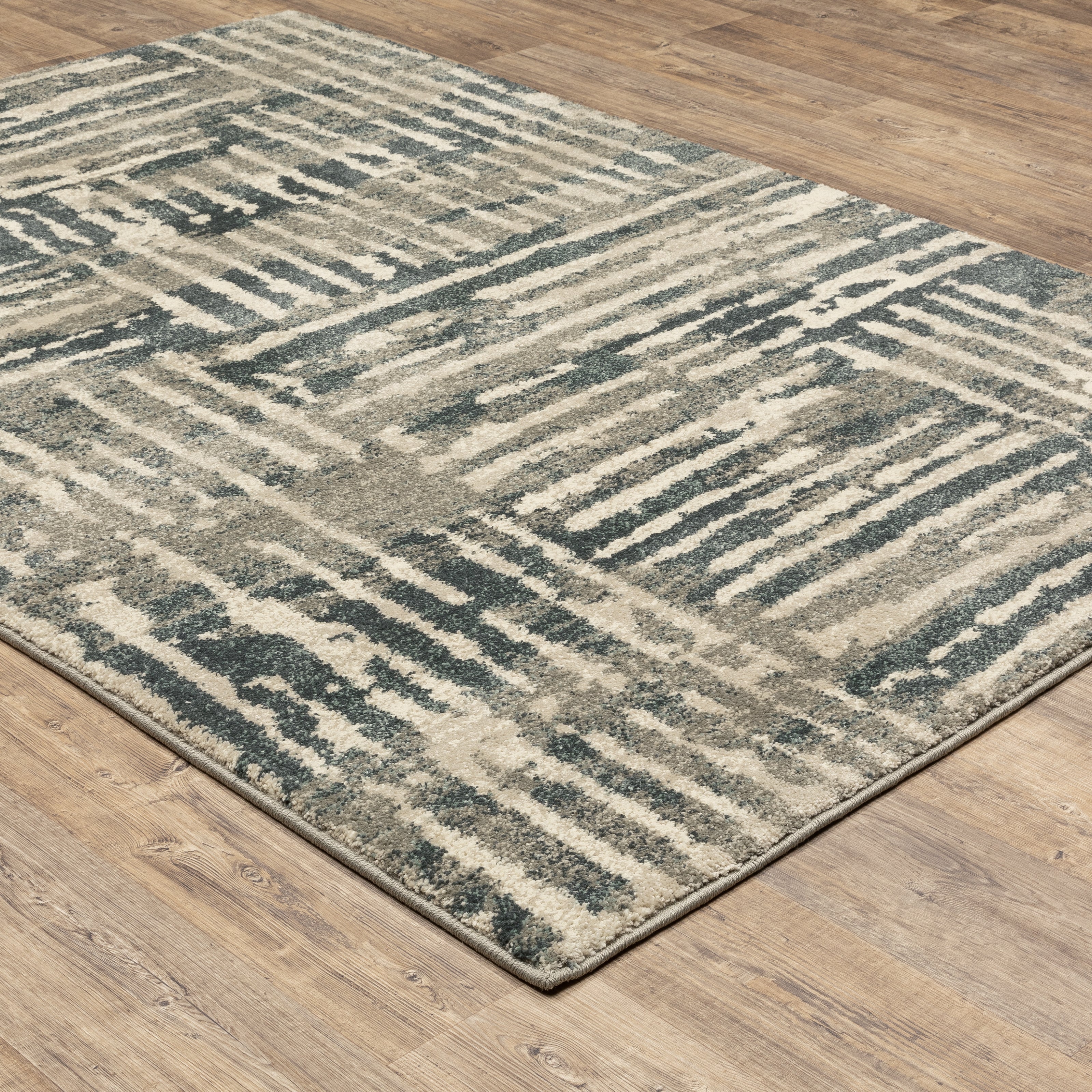 Oriental Weavers Carson 0745C plush modern rug featuring abstract pattern in blue/ beige tones