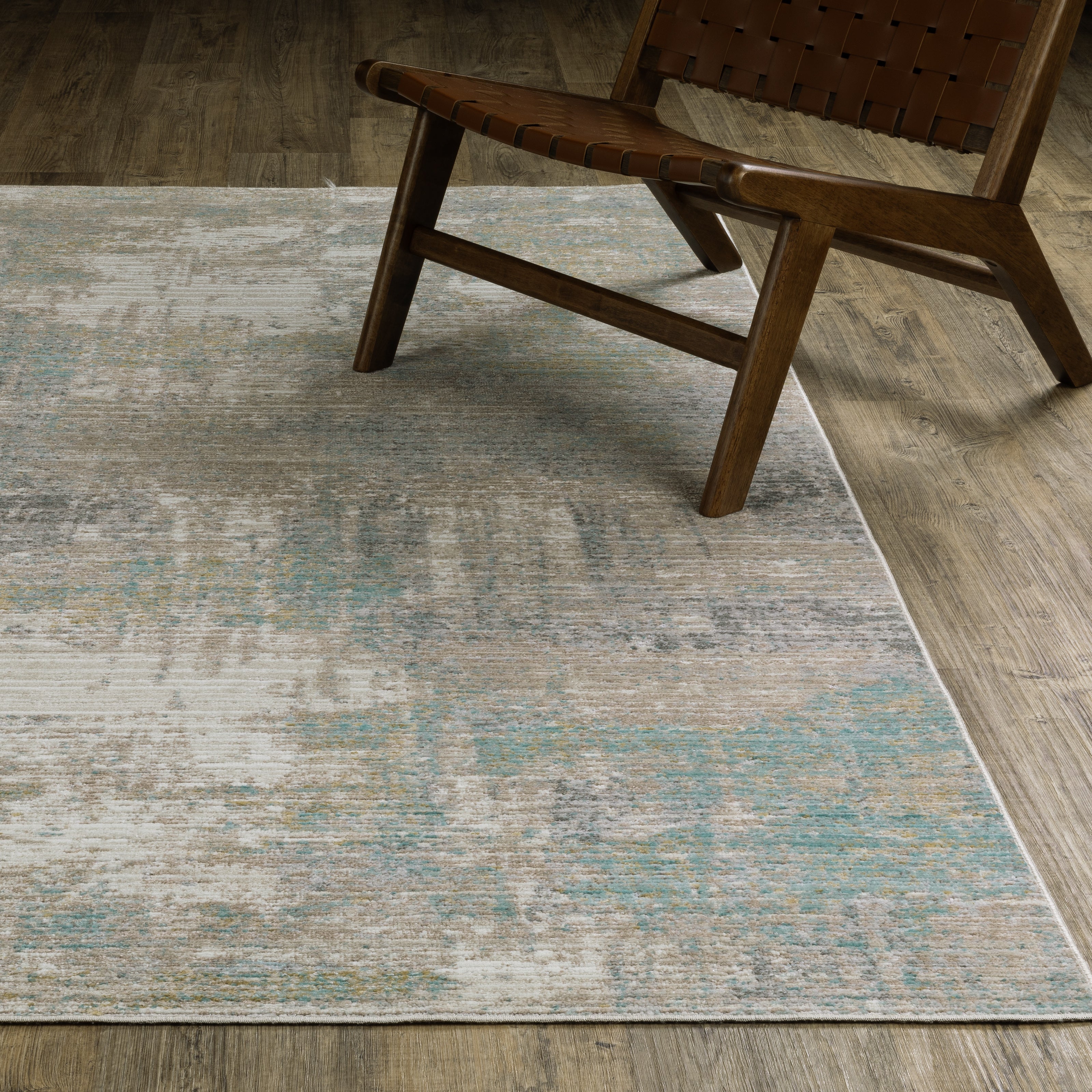 Oriental Weavers Cavett CAV01 soft transitional rug featuring decorative pattern in ivory/ teal tones