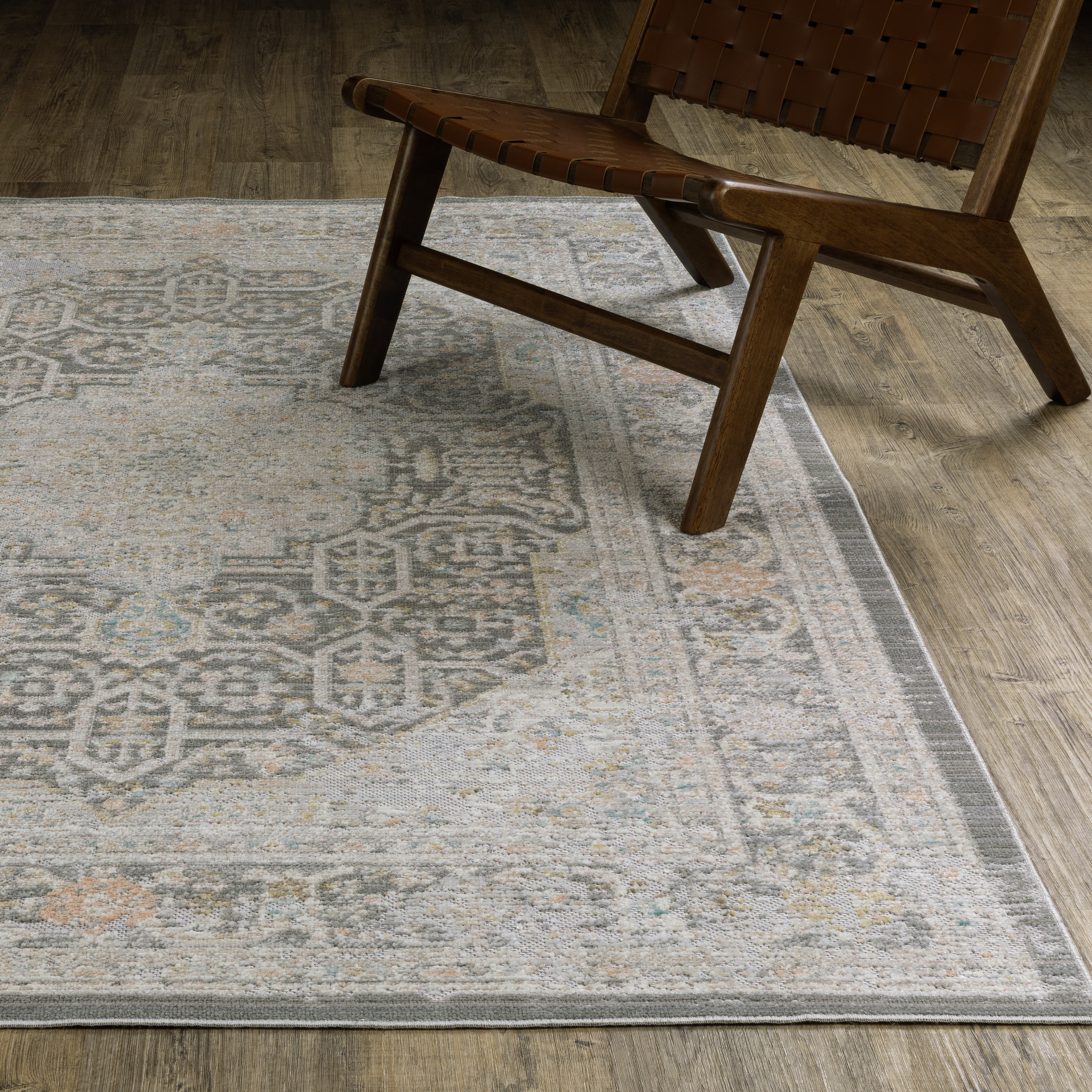 Oriental Weavers Cavett CAV02 soft transitional rug featuring decorative pattern in grey/ orange tones