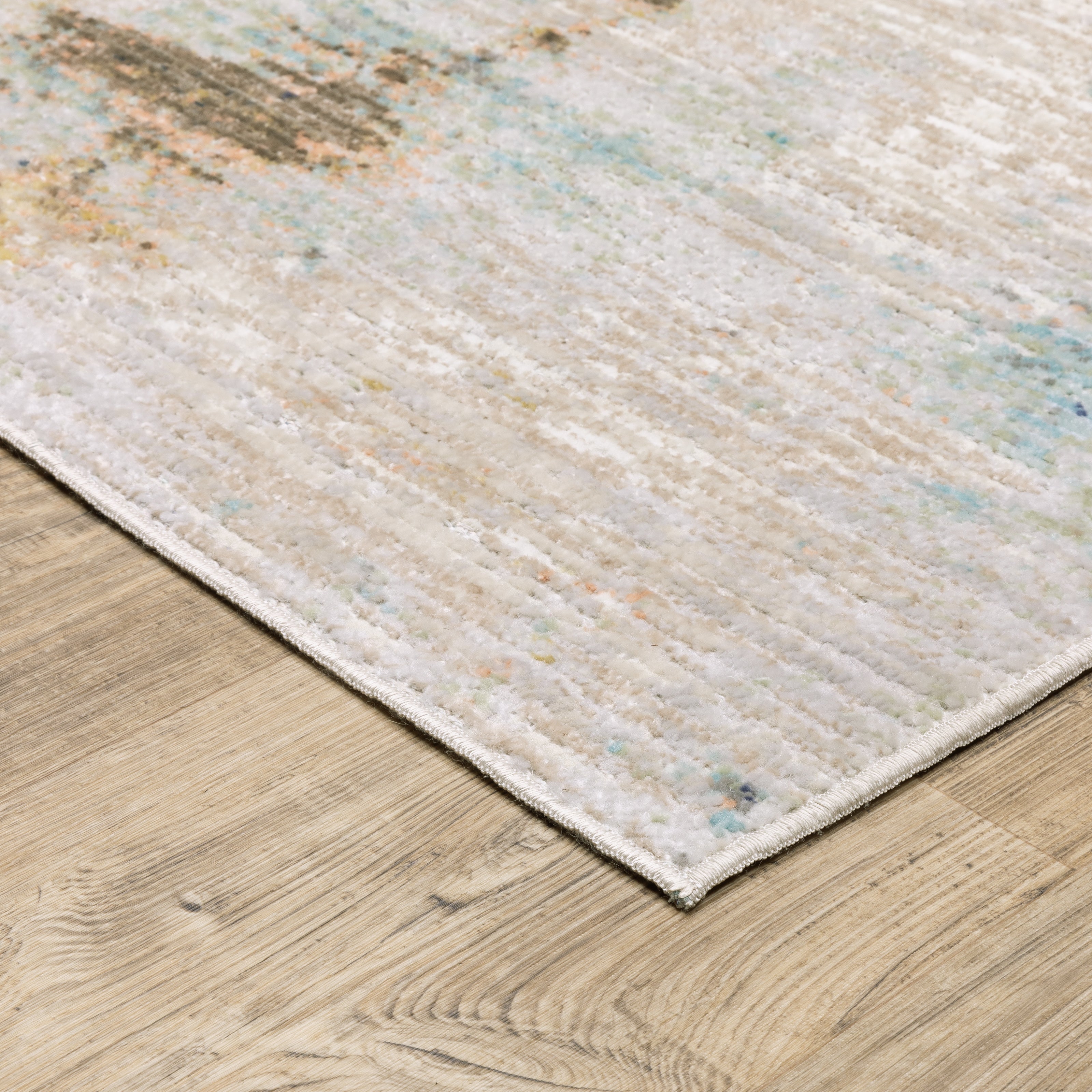 Oriental Weavers Cavett CAV03 soft transitional rug featuring decorative pattern in ivory/ blue tones