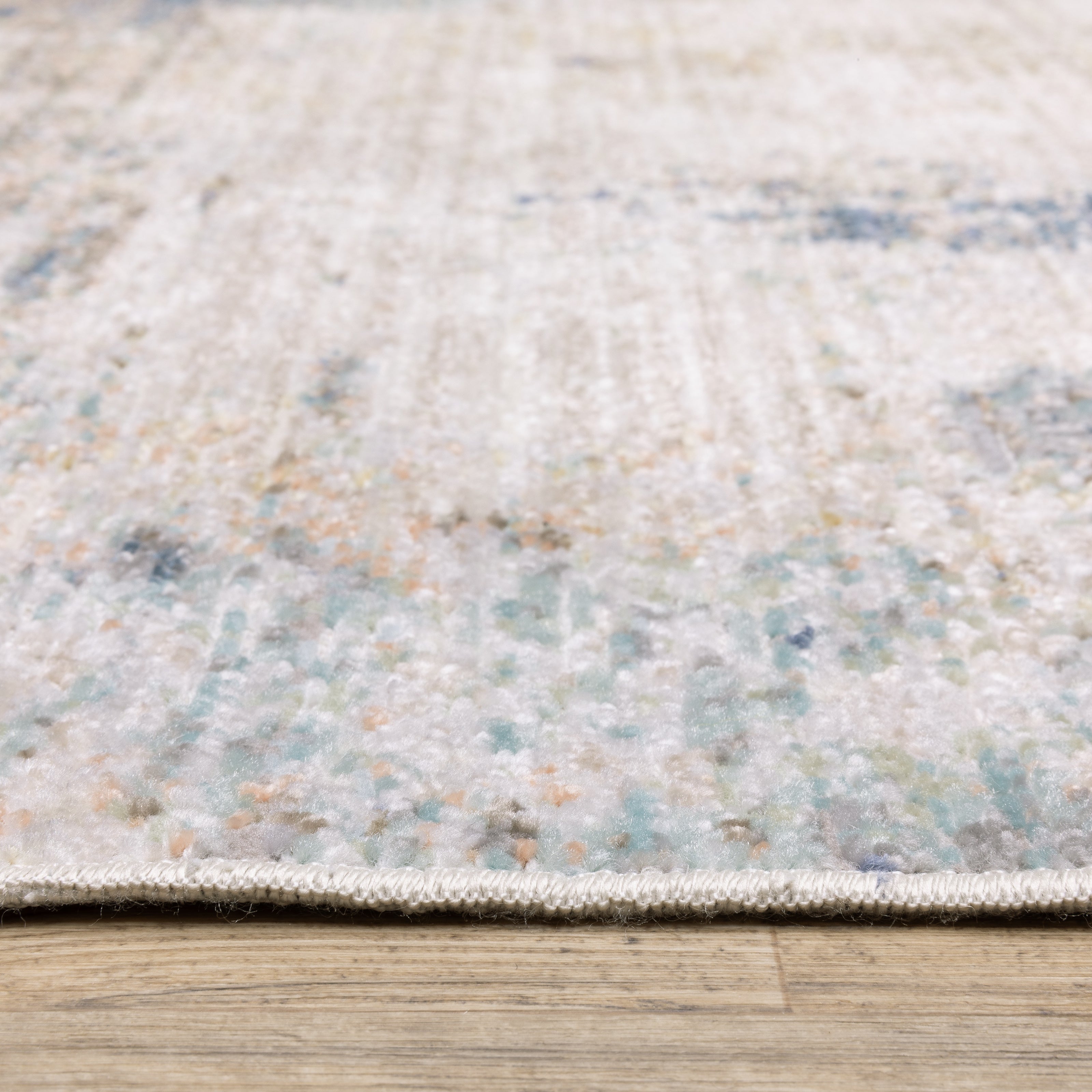 Oriental Weavers Cavett CAV03 soft transitional rug featuring decorative pattern in ivory/ blue tones