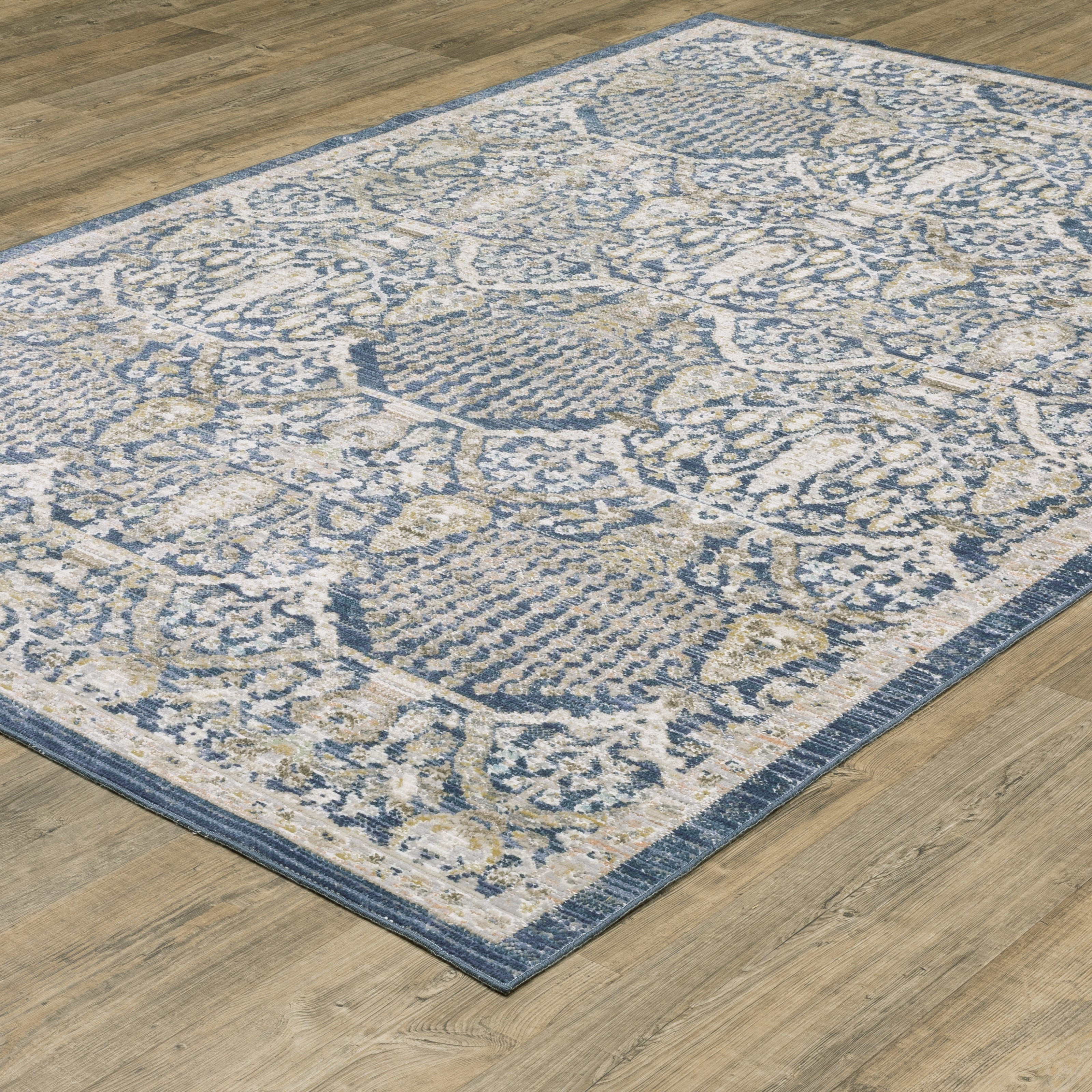 Oriental Weavers Cavett CAV06 soft transitional rug featuring decorative pattern in navy/ gold tones