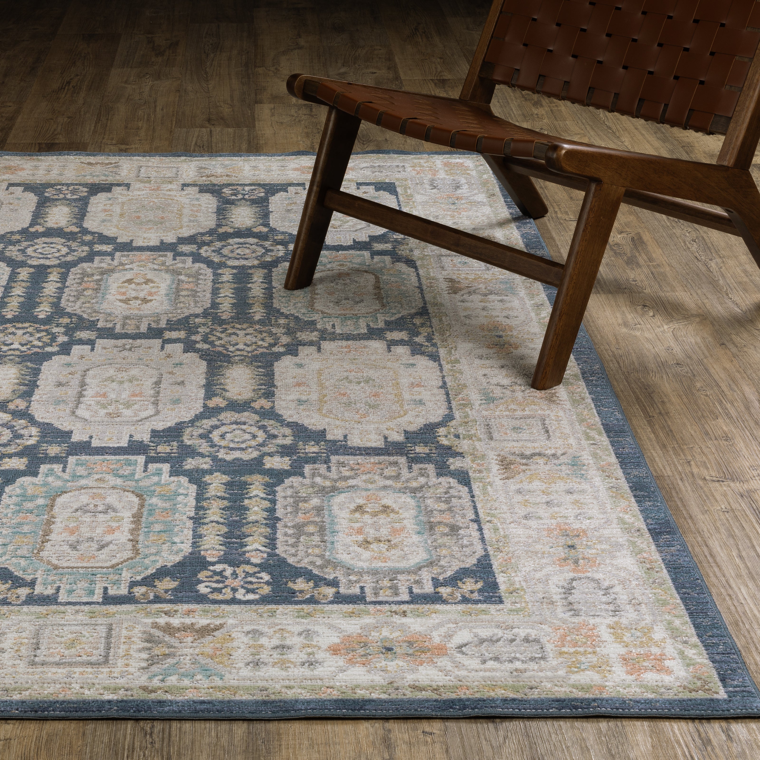 Oriental Weavers Cavett CAV07 soft transitional rug featuring decorative pattern in navy/ ivory tones