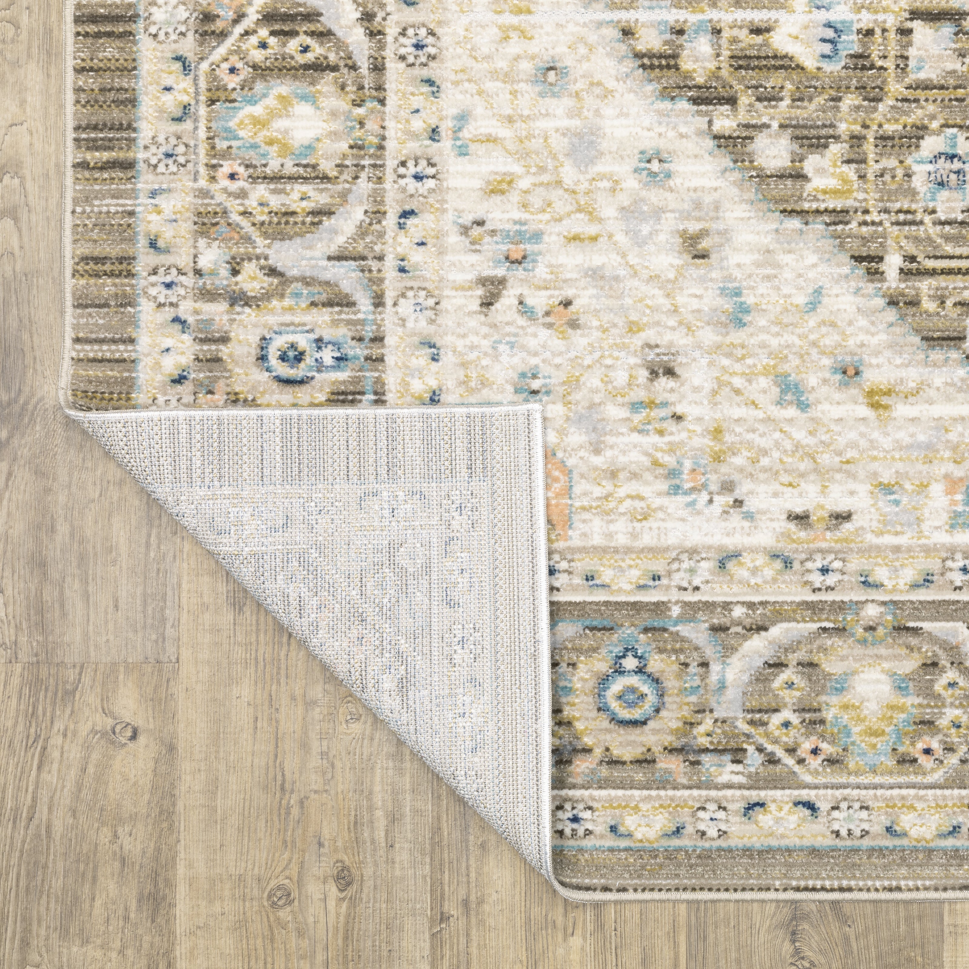 Oriental Weavers Cavett CAV12 soft transitional rug featuring decorative pattern in brown/ blue tones