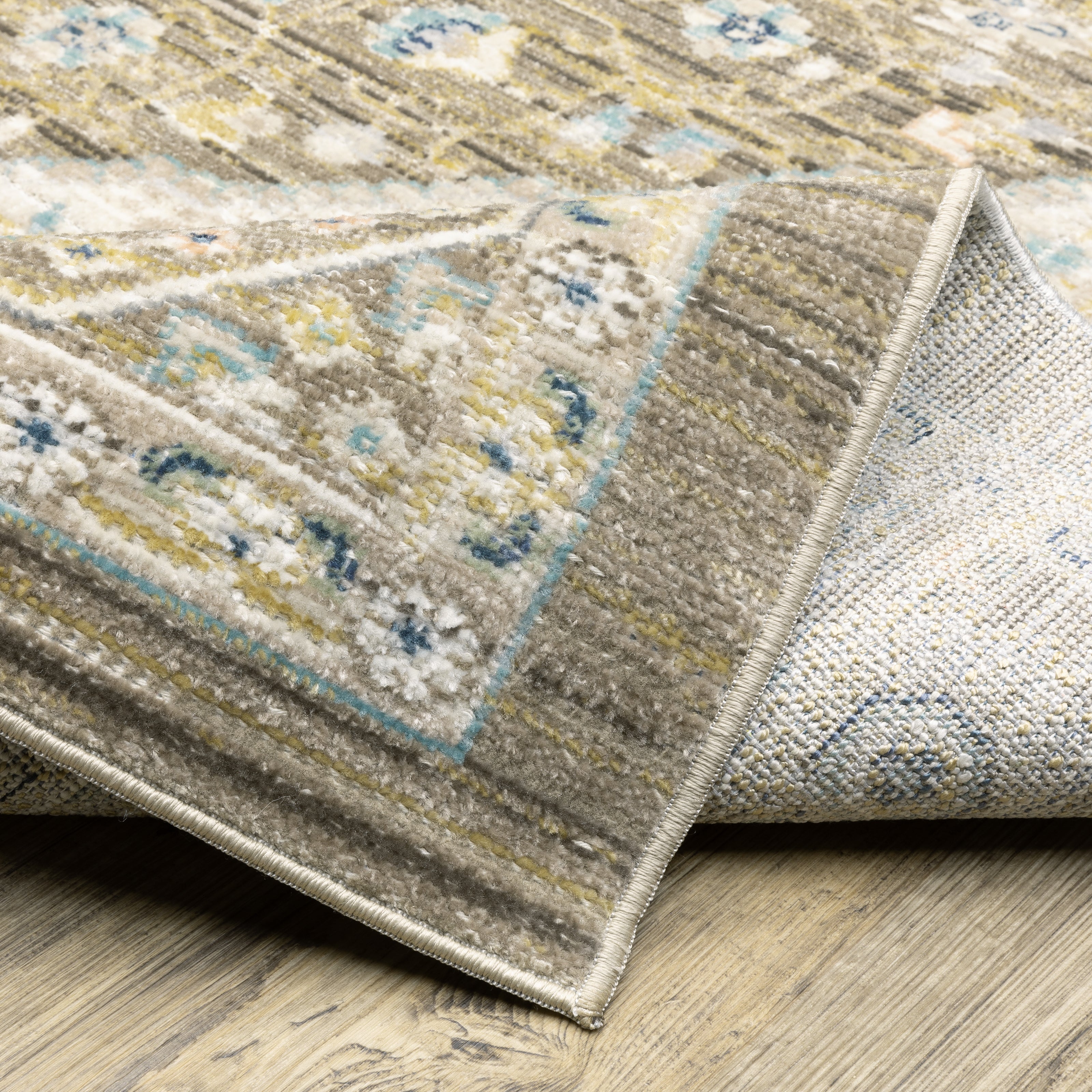 Oriental Weavers Cavett CAV12 soft transitional rug featuring decorative pattern in brown/ blue tones