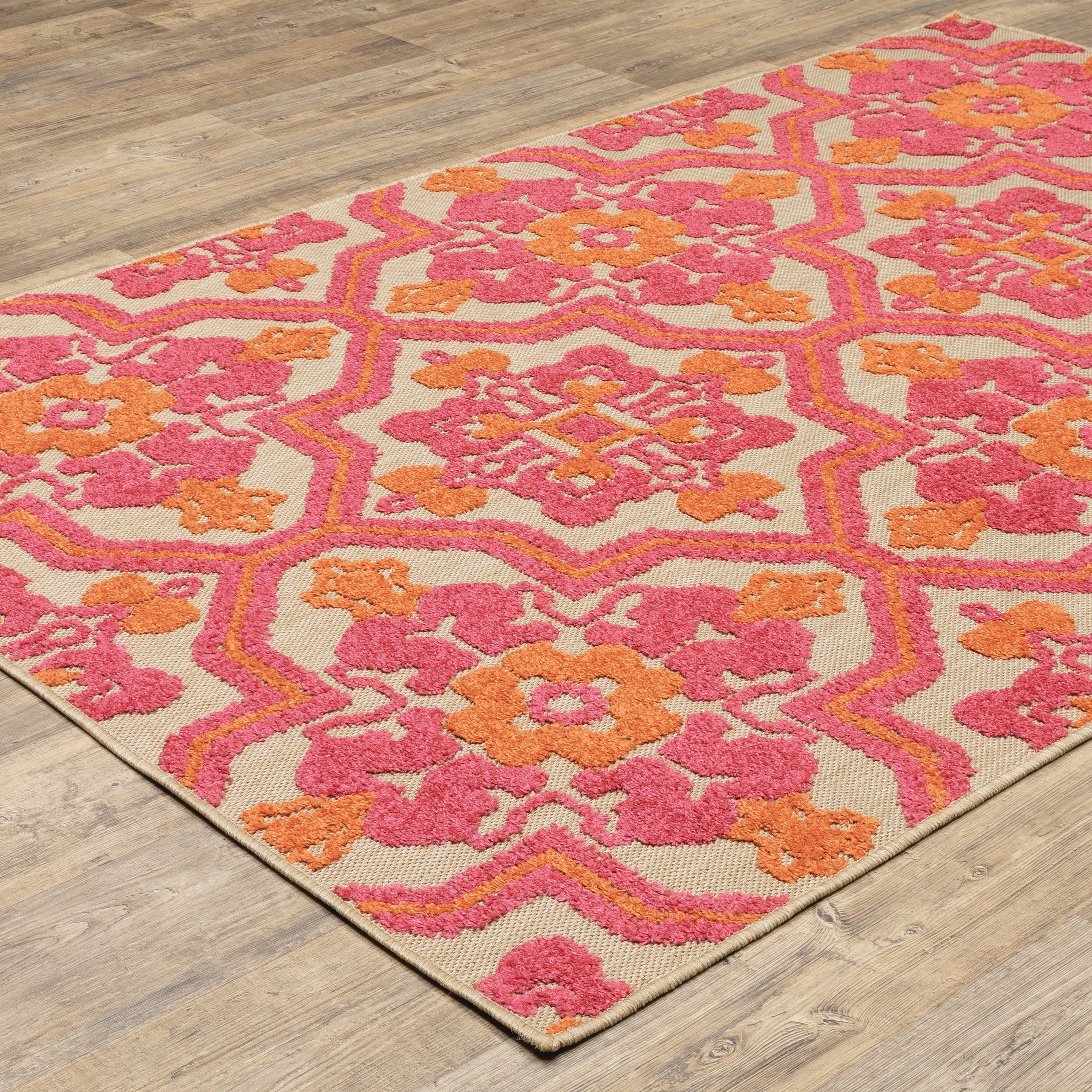 Oriental Weavers Cayman 2541V textured indoor-outdoor rug featuring abstract pattern in sand/ pink tones