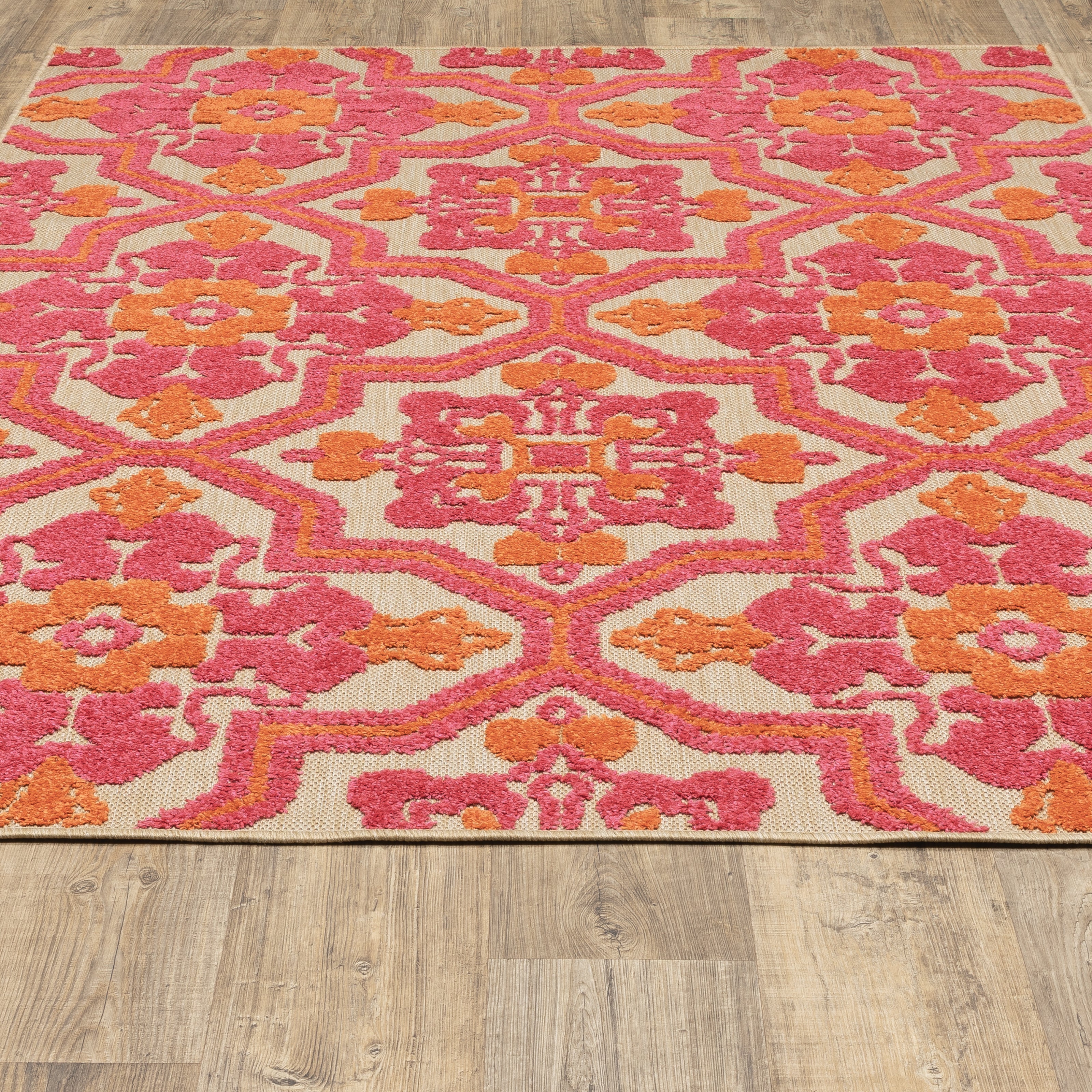 Oriental Weavers Cayman 2541V textured indoor-outdoor rug featuring abstract pattern in sand/ pink tones