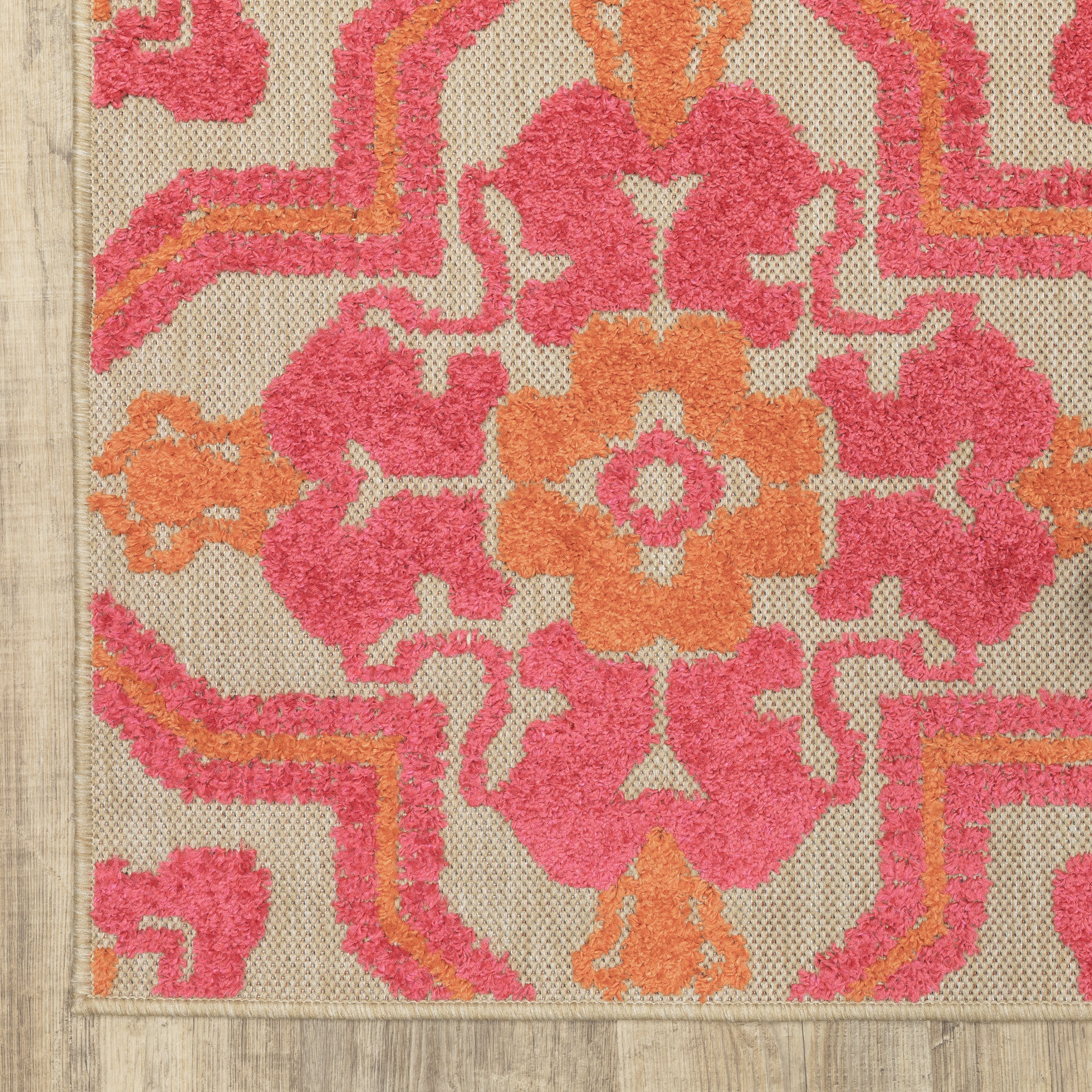 Oriental Weavers Cayman 2541V textured indoor-outdoor rug featuring abstract pattern in sand/ pink tones