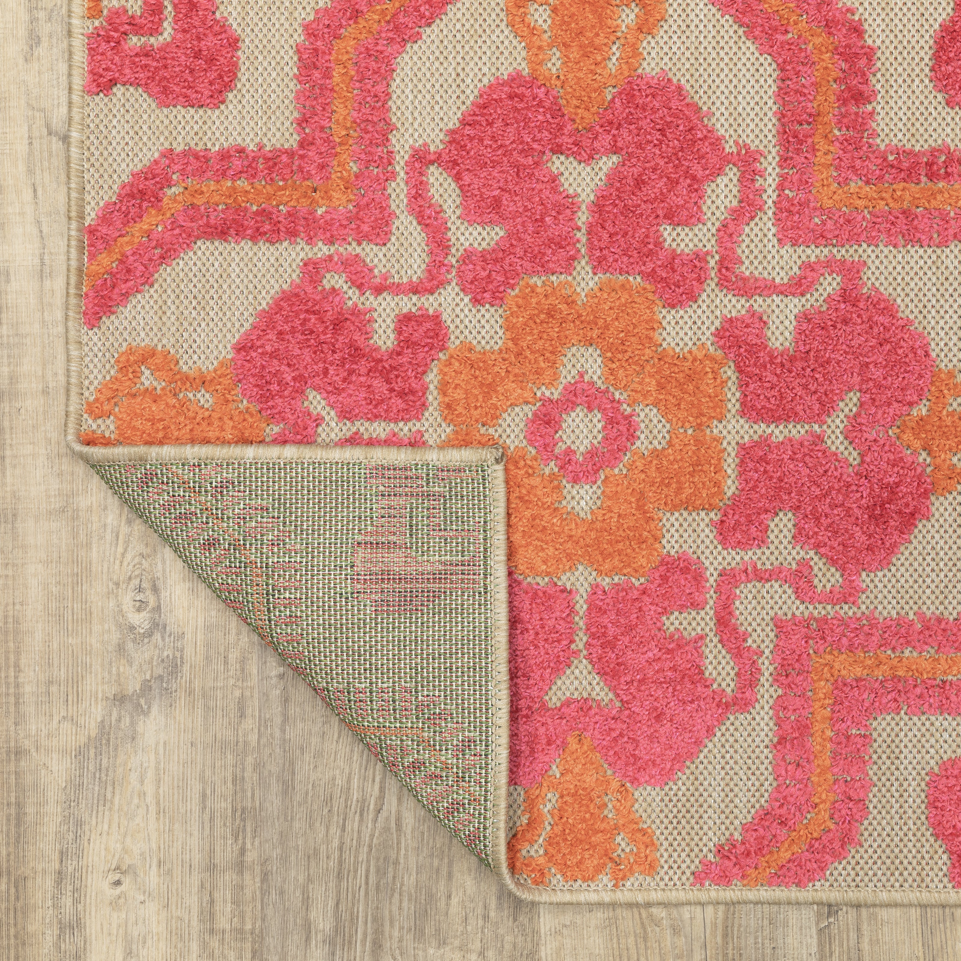 Oriental Weavers Cayman 2541V textured indoor-outdoor rug featuring abstract pattern in sand/ pink tones