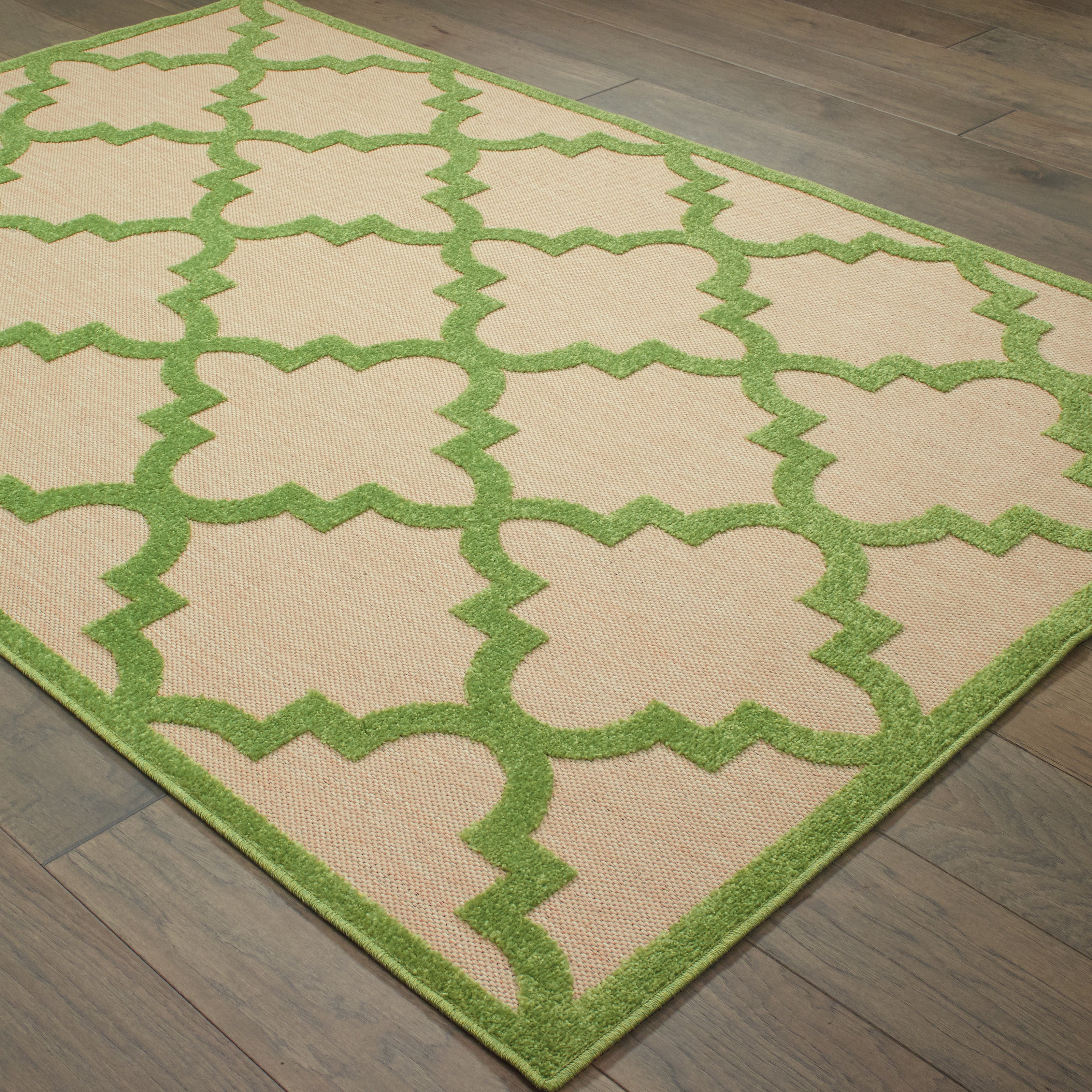 Oriental Weavers Cayman 660F9 textured indoor-outdoor rug featuring abstract pattern in sand/ green tones