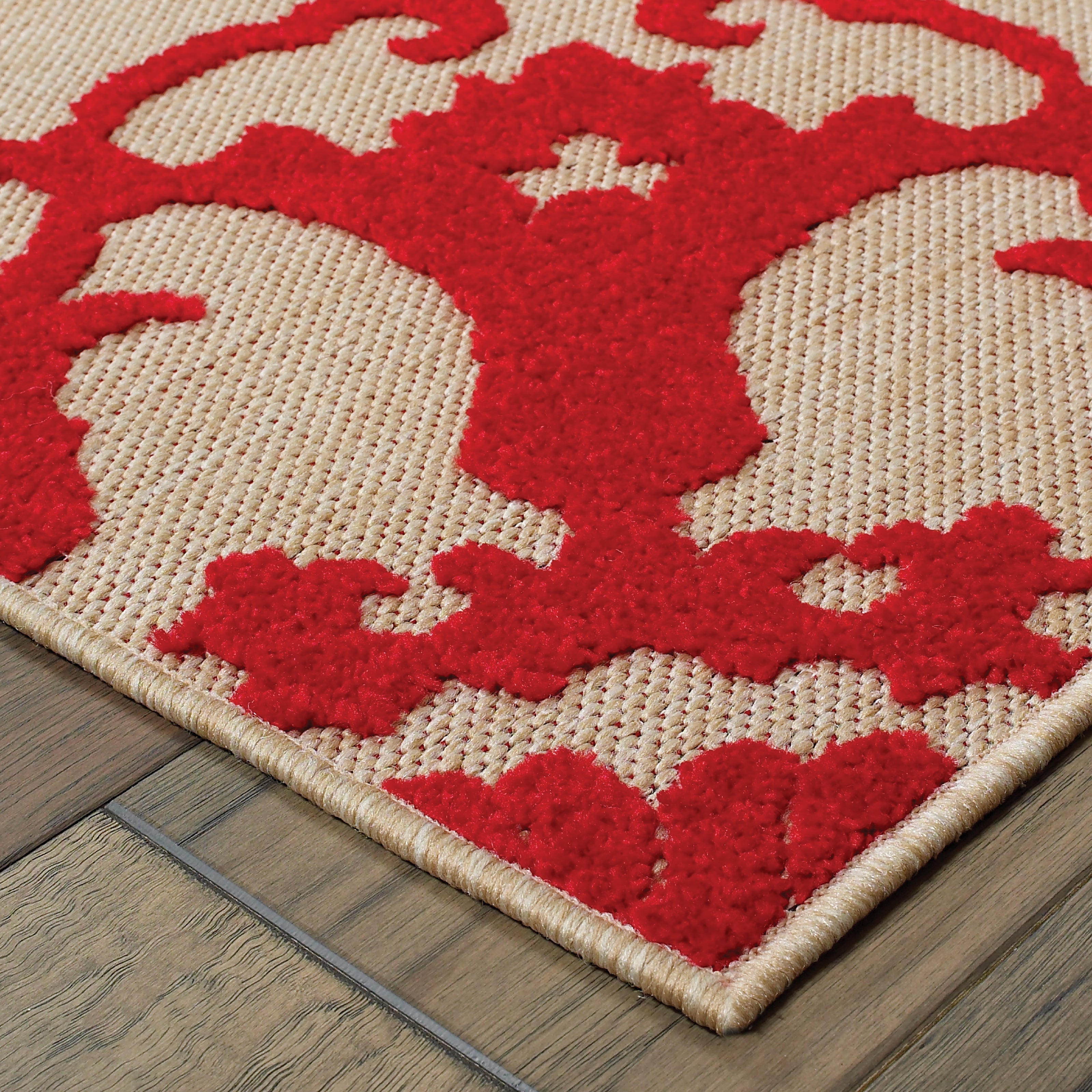 Oriental Weavers Cayman 097R9 textured indoor-outdoor rug featuring abstract pattern in sand/ red tones