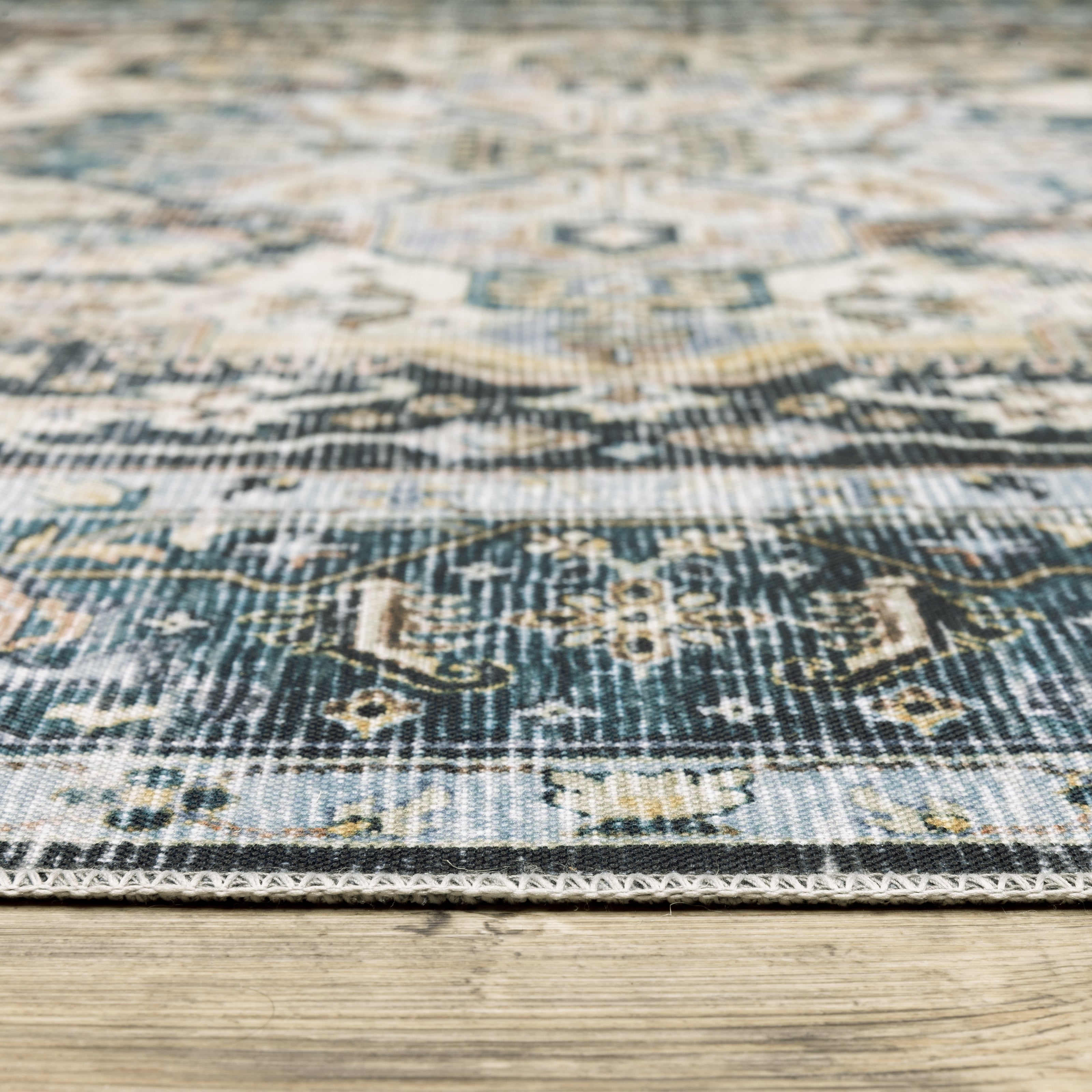 Oriental Weavers Charleston CHA01 traditional rug featuring decorative pattern in blue/ ivory tones