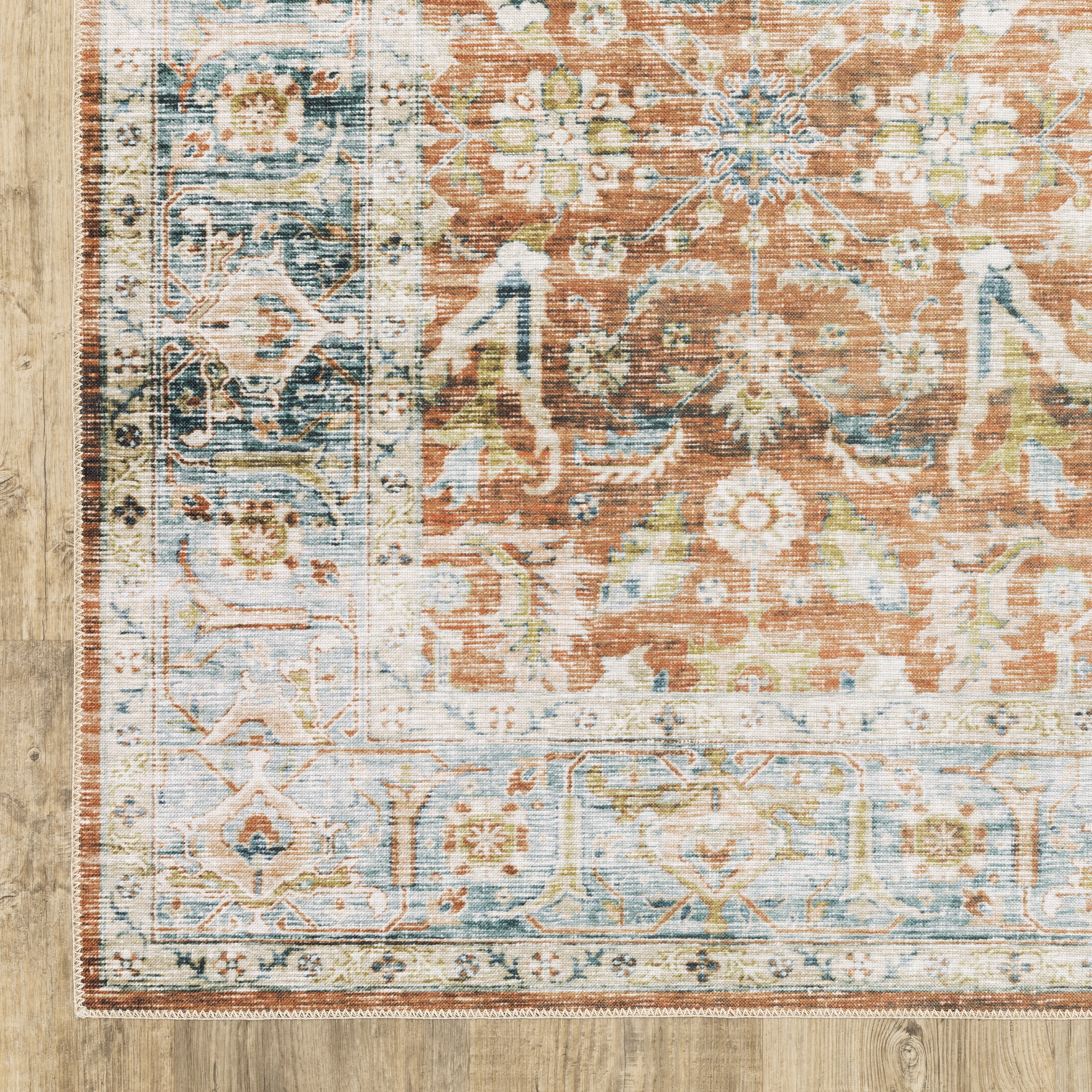 Oriental Weavers Charleston CHA04 traditional rug featuring decorative pattern in rust/ blue tones