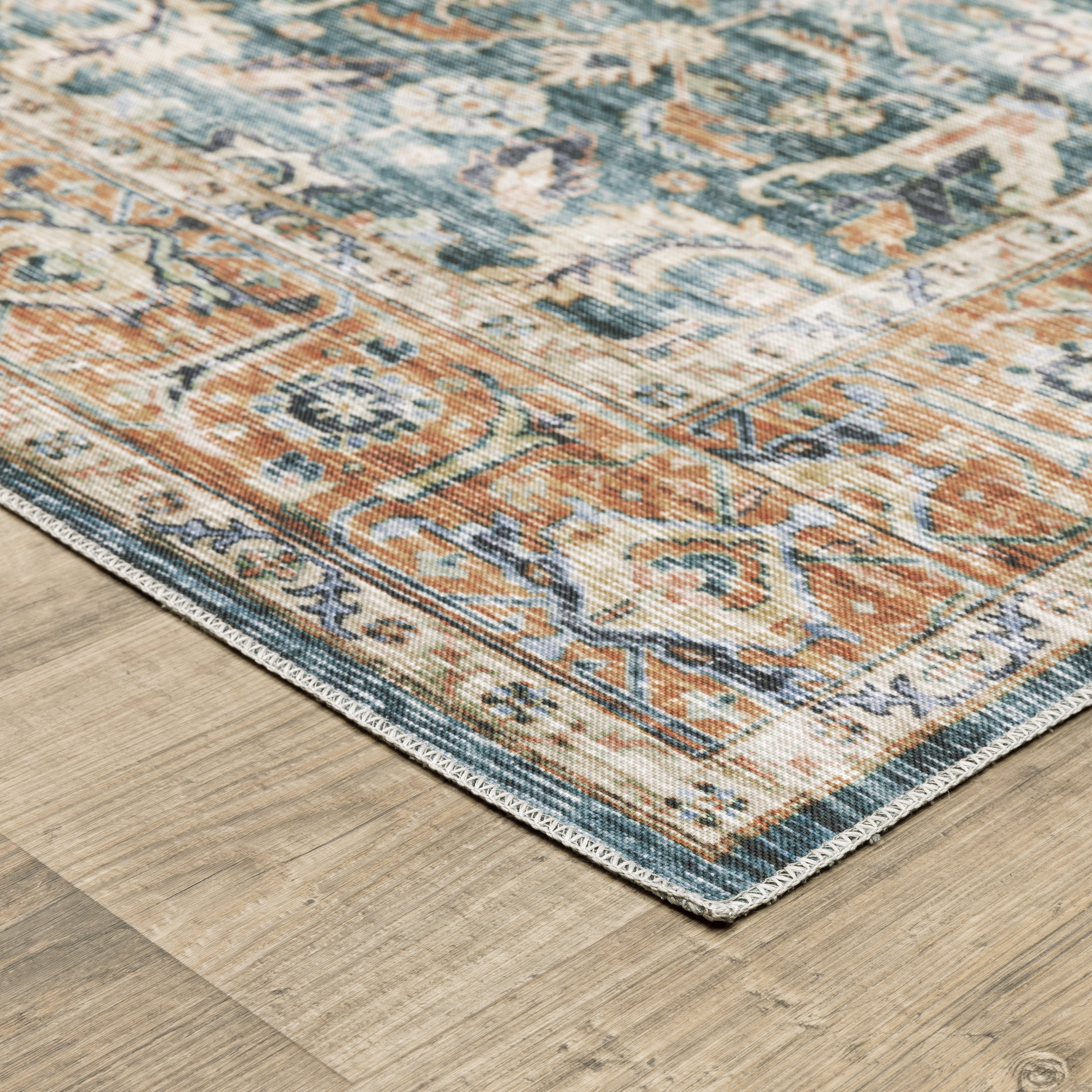 Oriental Weavers Charleston CHA06 traditional rug featuring decorative pattern in blue/ rust tones