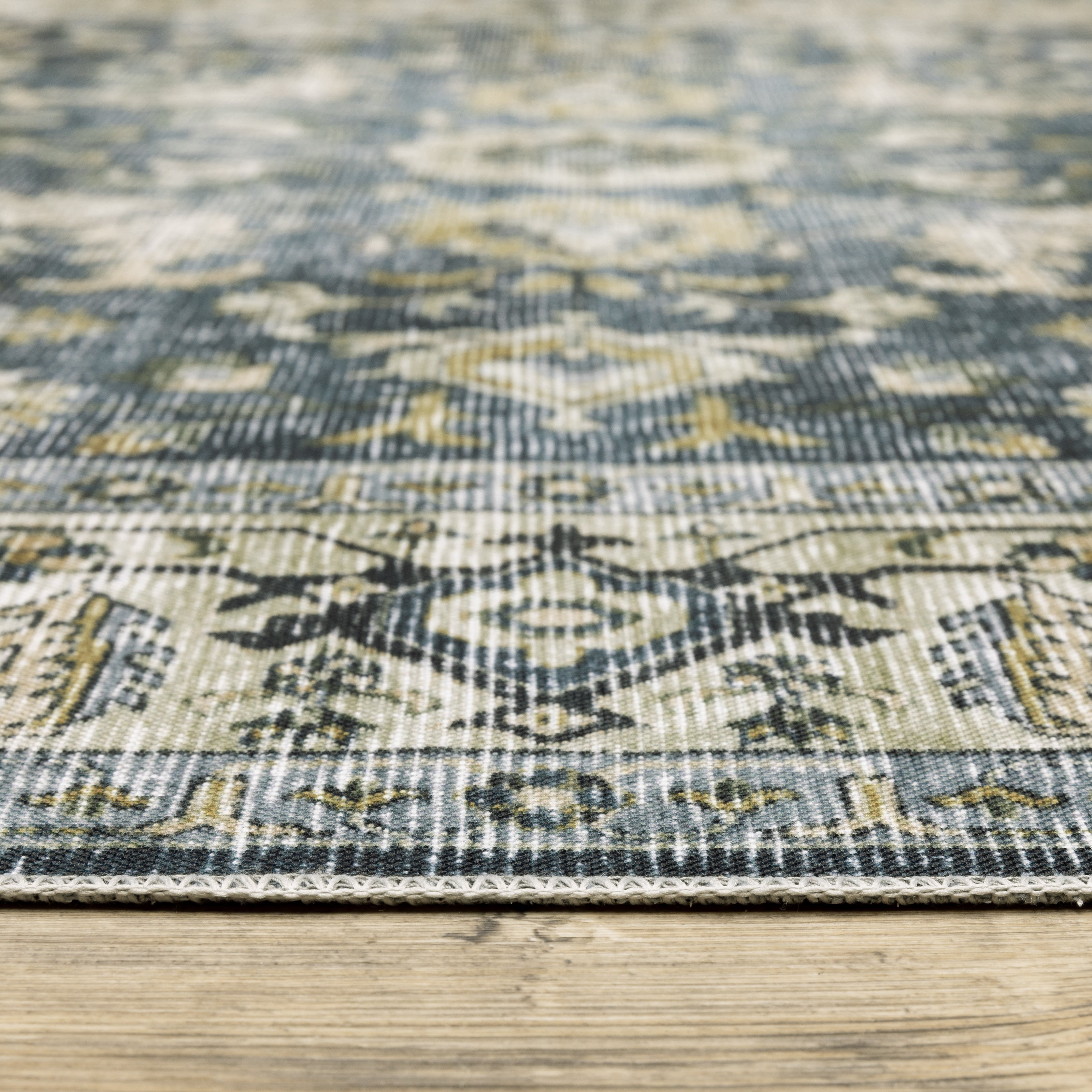 Oriental Weavers Charleston CHA08 traditional rug featuring decorative pattern in blue/ gold tones