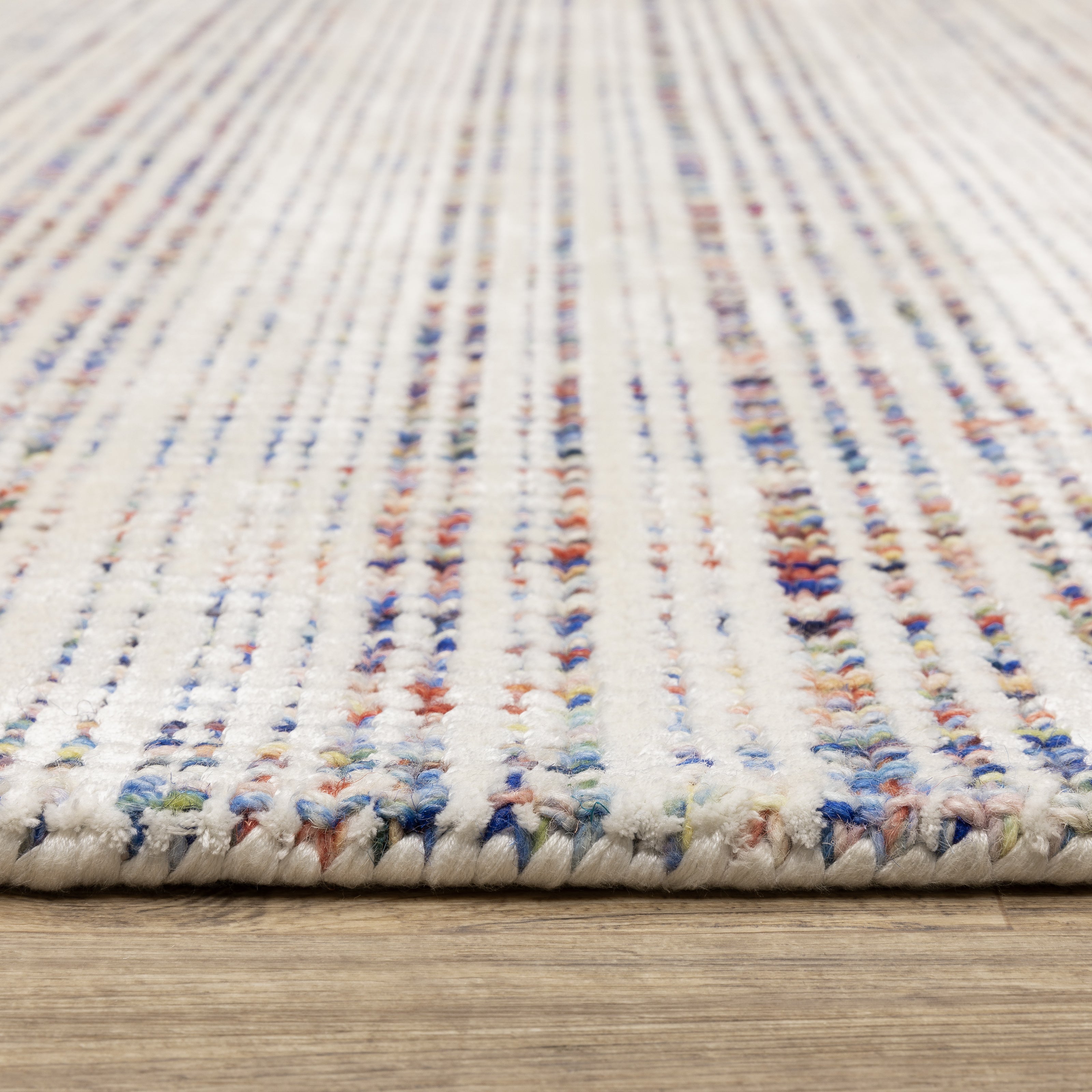 Oriental Weavers Circa CIR01 soft area rug featuring textured design in ivory/ multi tones