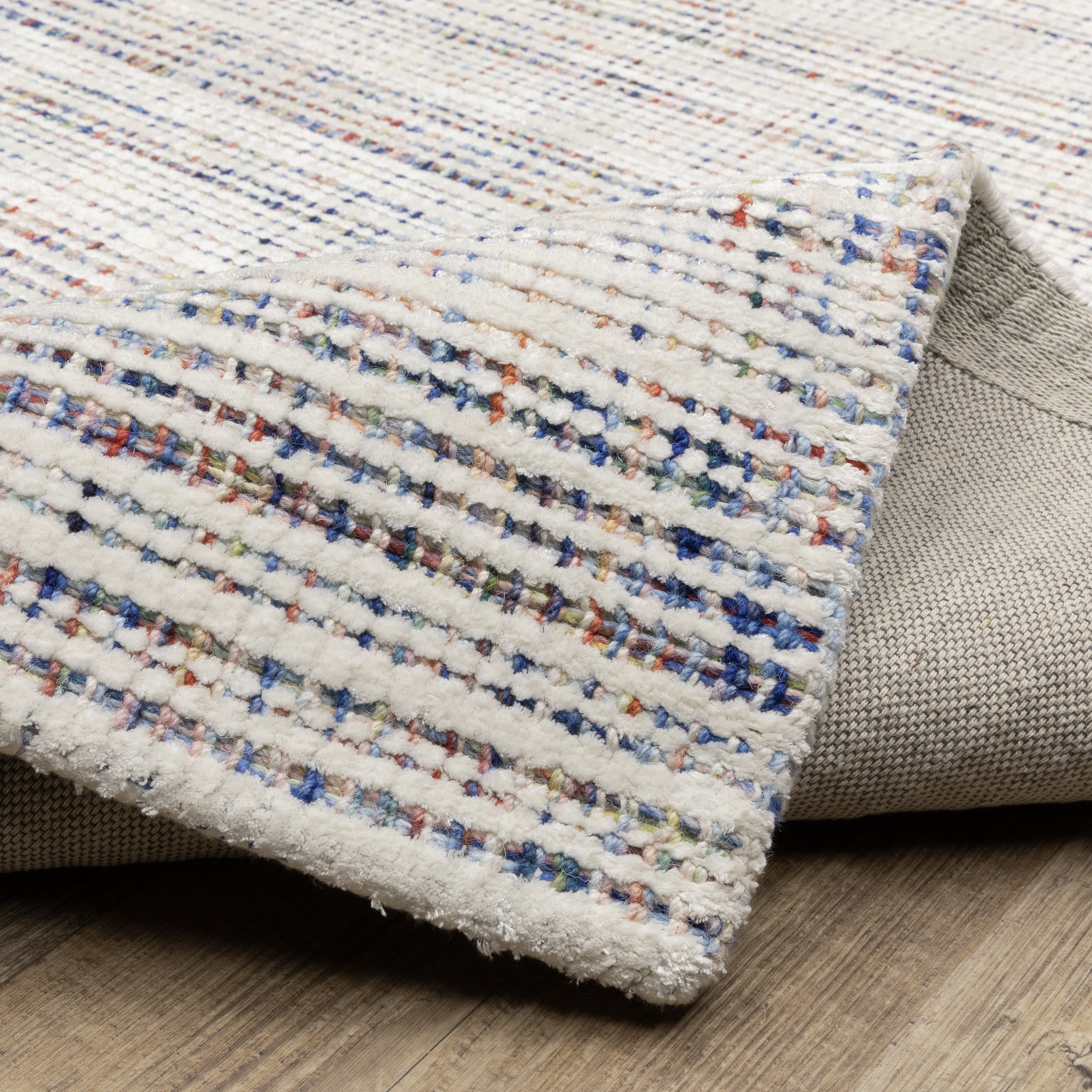 Oriental Weavers Circa CIR01 soft area rug featuring textured design in ivory/ multi tones