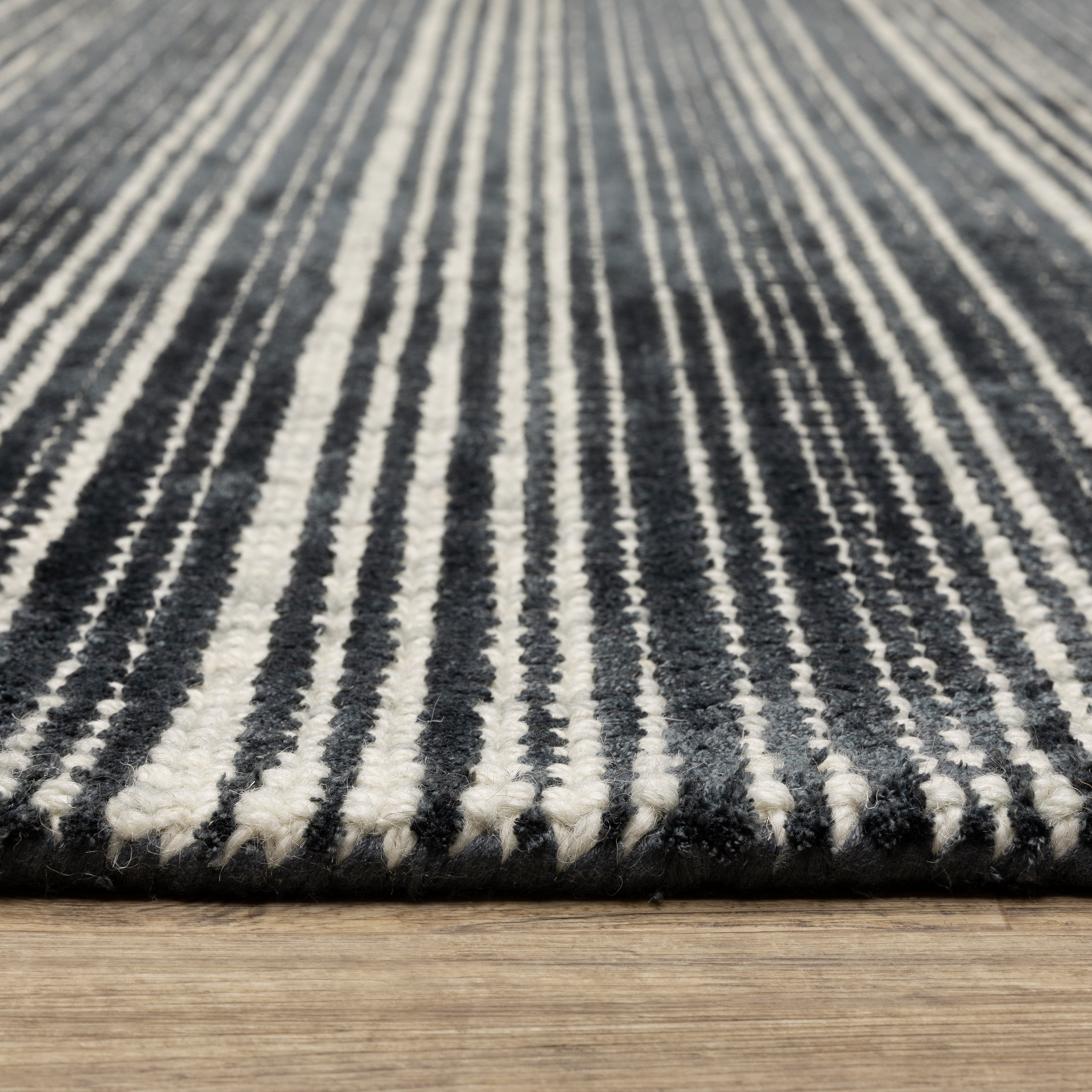 Oriental Weavers Circa CIR02 soft area rug featuring textured design in black/ ivory tones