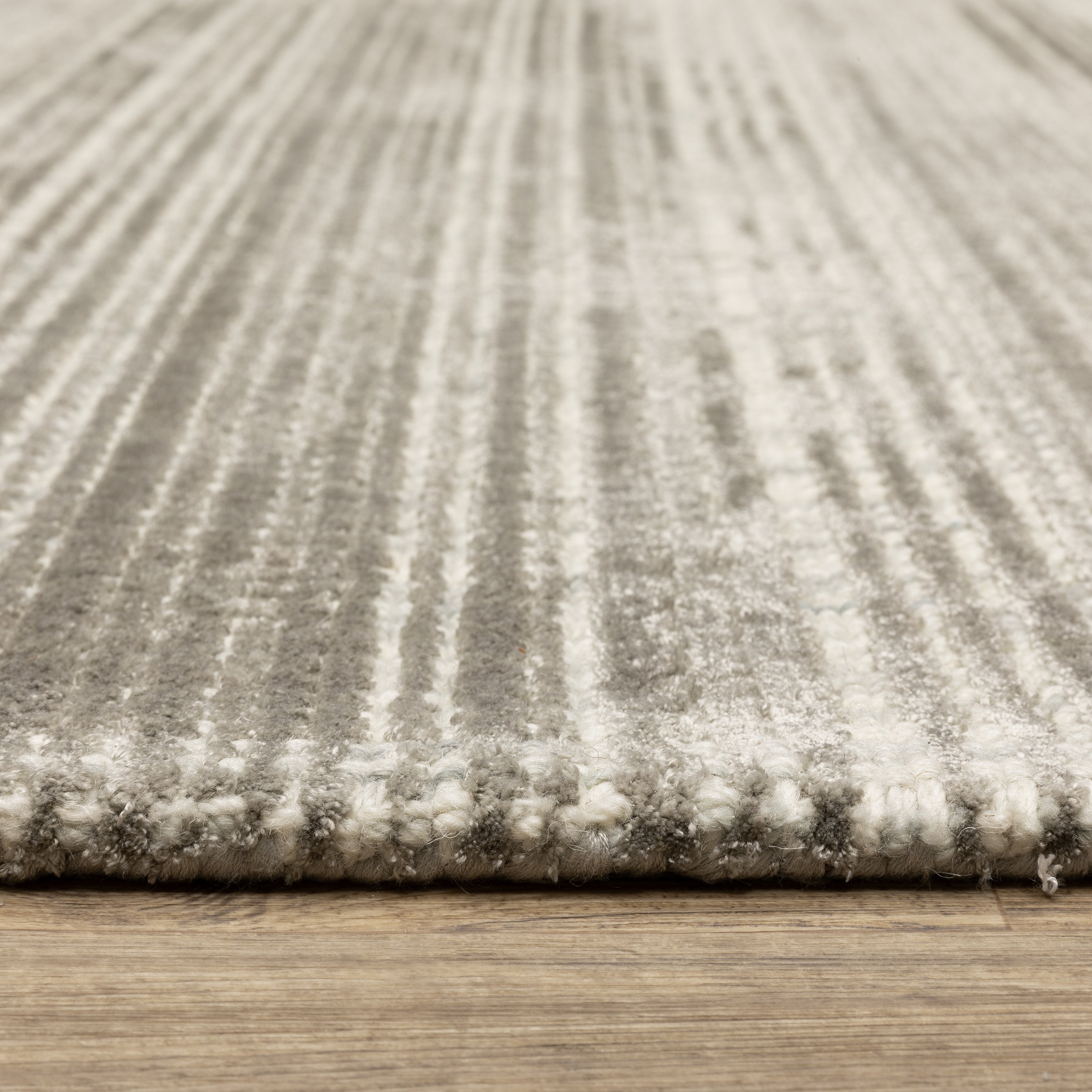 Oriental Weavers Circa CIR04 soft area rug featuring textured design in grey/ ivory tones