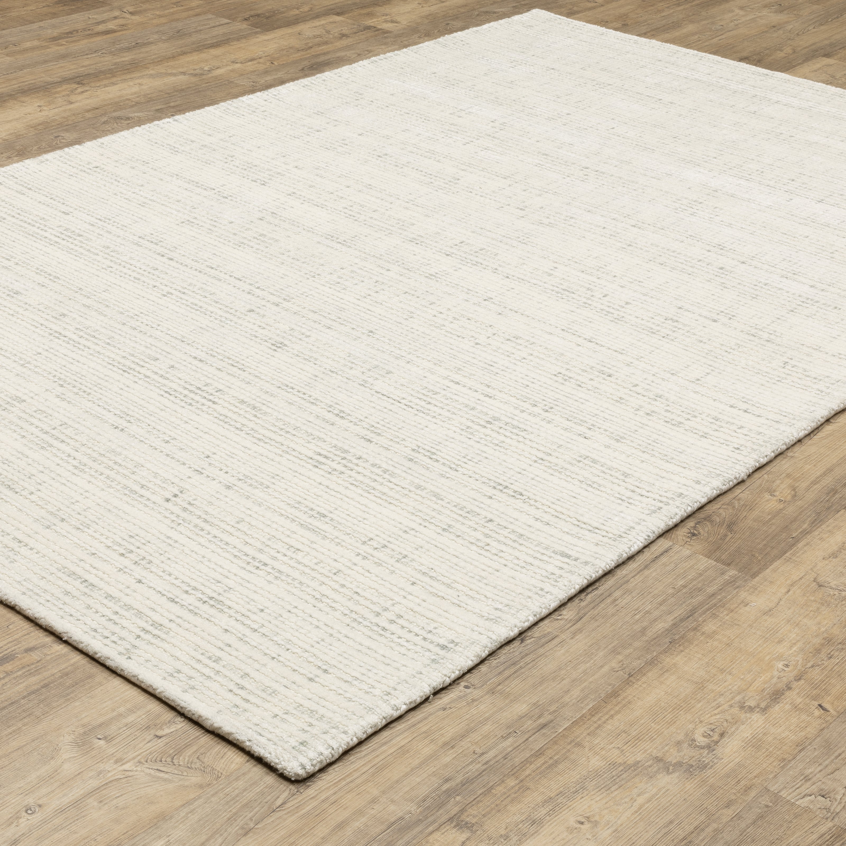 Oriental Weavers Circa CIR08 soft modern rug featuring textured design in ivory/ grey tones