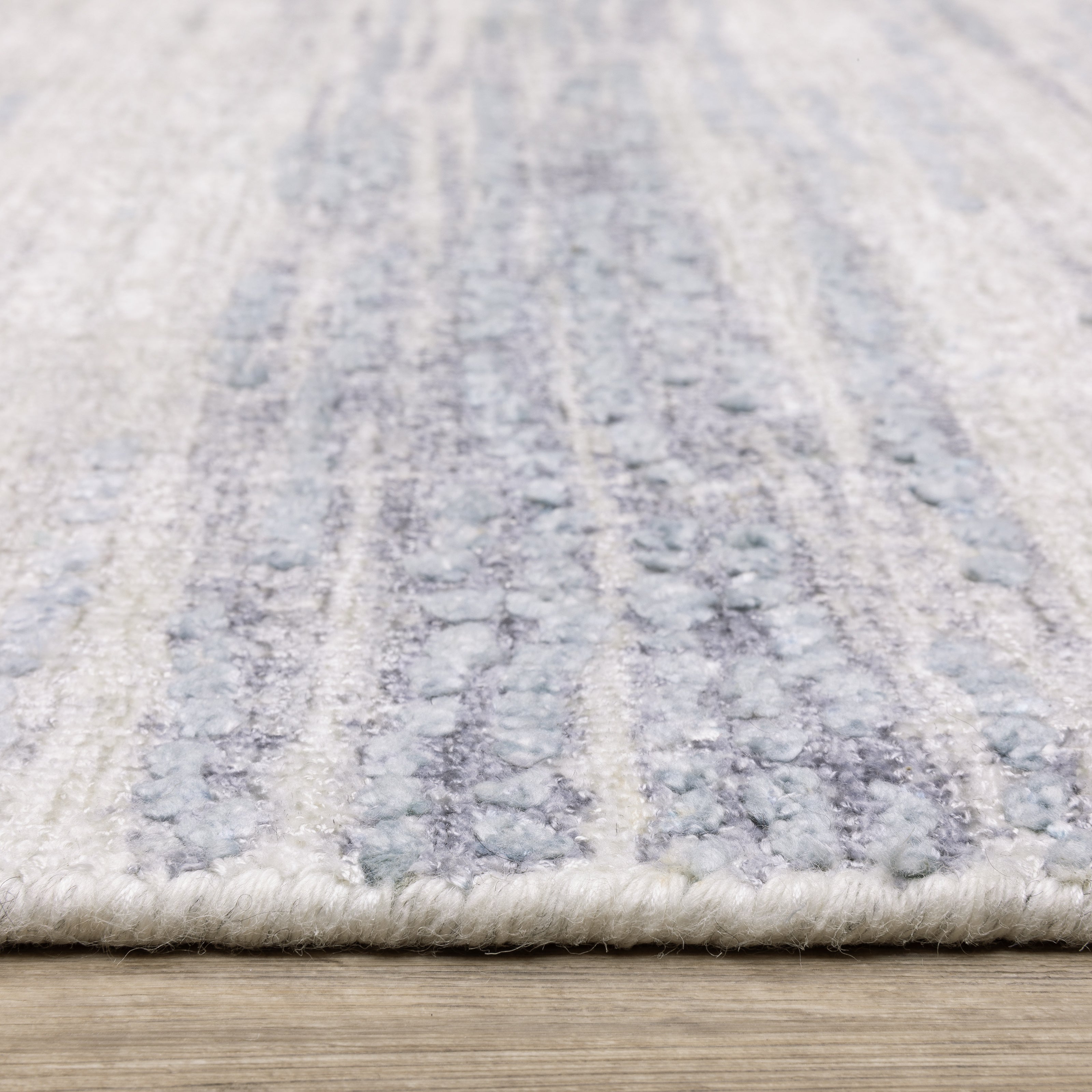 Oriental Weavers Clarke CLA04 soft modern rug featuring abstract pattern in ivory/ blue tones
