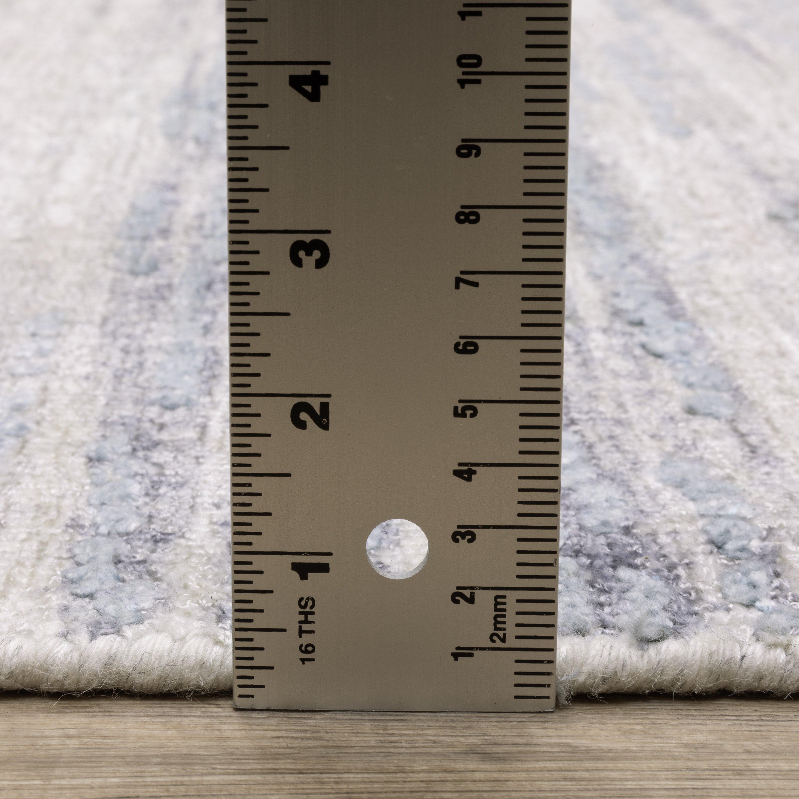 Oriental Weavers Clarke CLA04 soft modern rug featuring abstract pattern in ivory/ blue tones