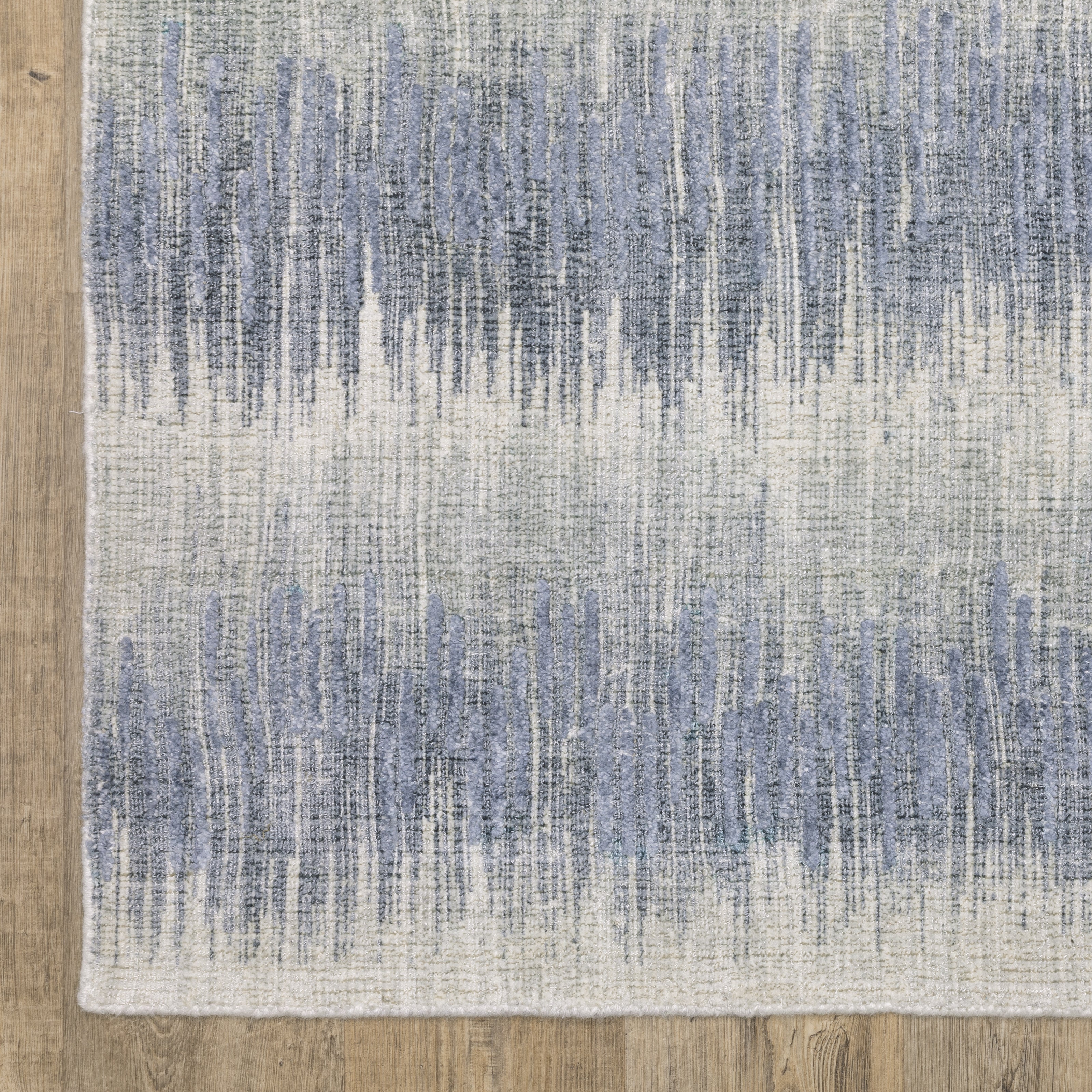 Oriental Weavers Clarke CLA06 soft modern rug featuring abstract pattern in blue/ ivory tones