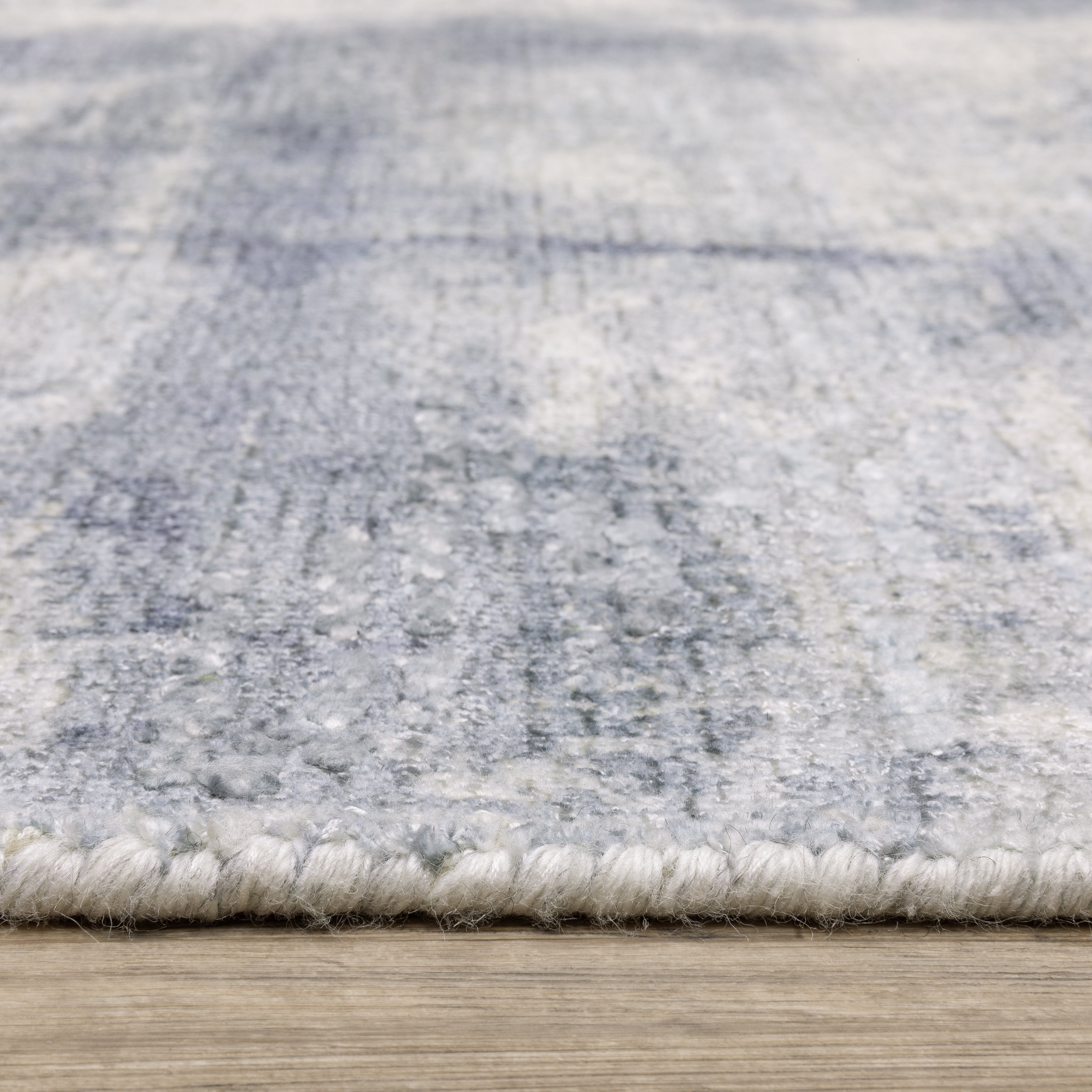 Oriental Weavers Clarke CLA07 soft modern rug featuring abstract pattern in blue/ ivory tones