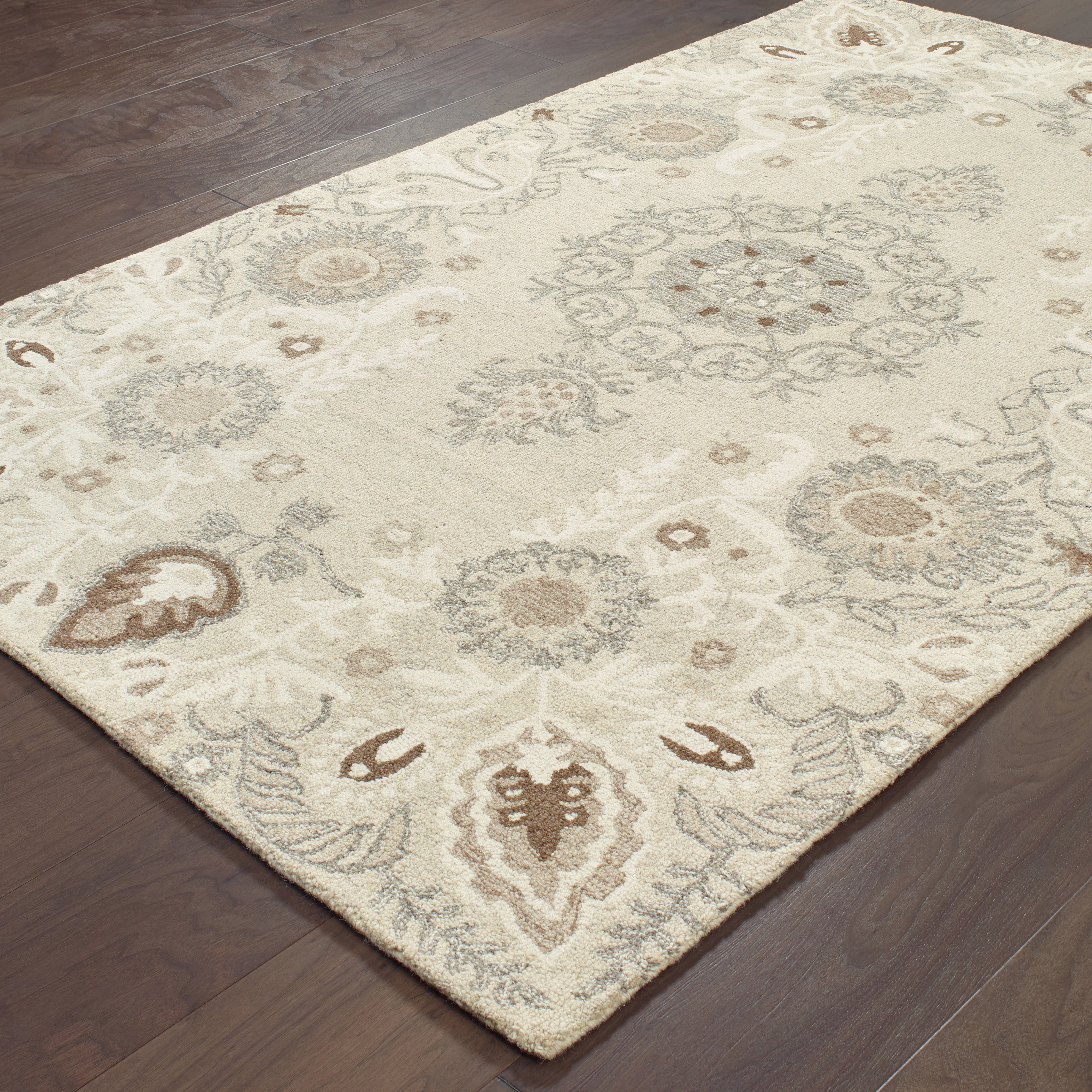 Oriental Weavers Craft 93000 soft traditional rug featuring decorative pattern in sand/ ash tones