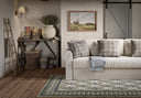 This charming rug from the Momeni Cotswold Collection captures the heart of English countryside living with its delicate, hand-tufted rose motifs arranged in neat rows across a soft ivory ground.
